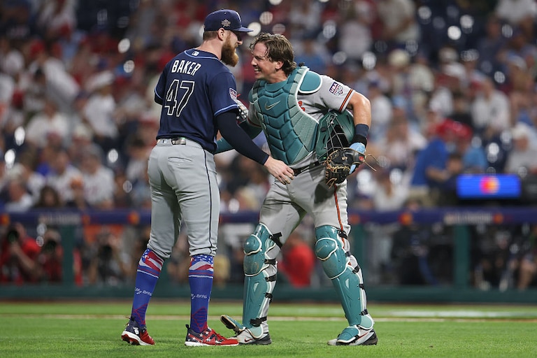 Bryan Baker of the Tampa Bay Rays and Adley Rutschman of the Baltimore Orioles embrace after the ninth inning of the 2026 MLB All-Star Game.