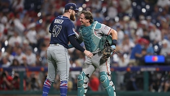Bryan Baker of the Tampa Bay Rays and Adley Rutschman of the Baltimore Orioles embrace after the ninth inning of the 2026 MLB All-Star Game.