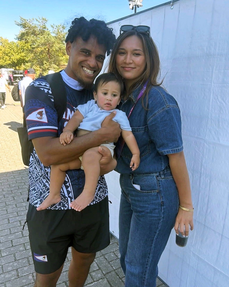 Taulia Tagovailoa, wife Amryi-Grace Tagovailoa and their 10-month old son Pacqston spend a moment together in Düsseldorf, Germany. Taulia, a former Terps quarterback, helped lead the American Samoa flag football team to a fifth-place finish at the World Championships, and he harbors ambitions of helping the team get to the 2028 Olympics.