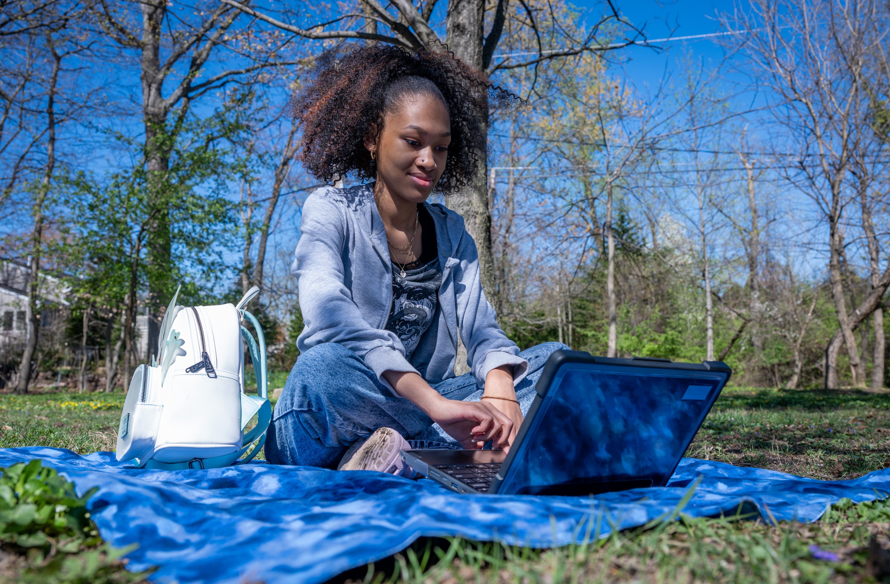 I’Yona Young, 18, is enrolled in Baltimore County Public Schools’ online learning program. Riderwood Hills Park is among the places she likes to do her schoolwork.