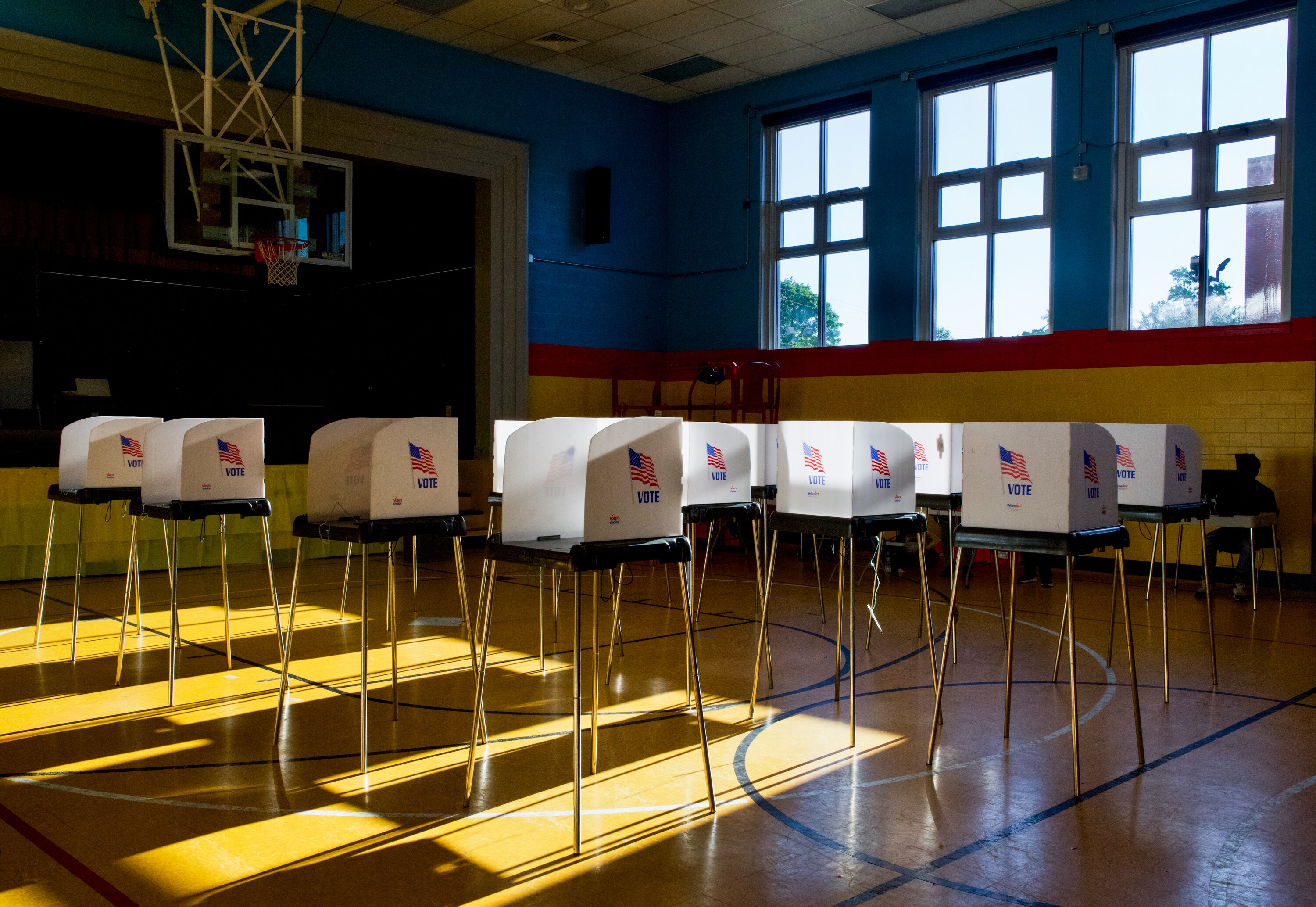 People cast their votes at Liberty Elementary, located at 3901 Maine Avenue in Baltimore, on Tuesday. At 6:30 p.m., the polling location was empty save for a few voters.