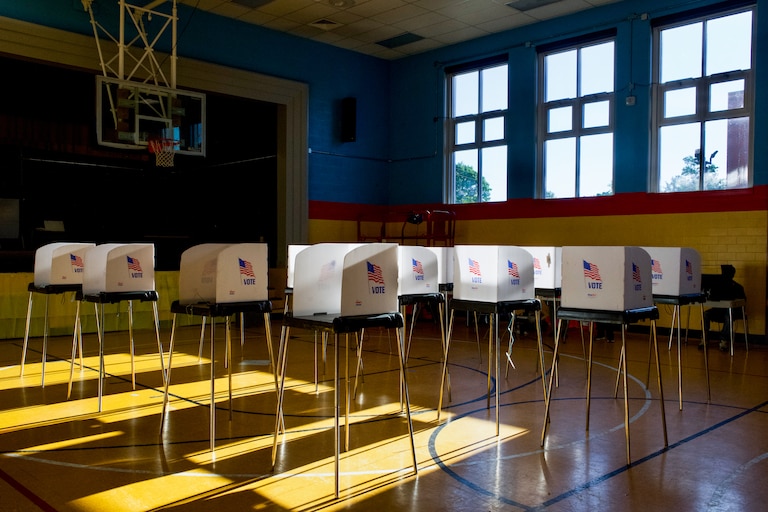People cast their votes at Liberty Elementary, located at 3901 Maine Avenue in Baltimore, on Tuesday. At 6:30 p.m., the polling location was empty save for a few voters.