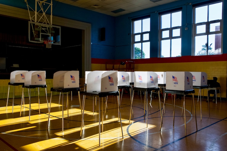 People cast their votes at Liberty Elementary, located at 3901 Maine Avenue in Baltimore, on Tuesday. At 6:30 p.m., the polling location was empty save for a few voters.