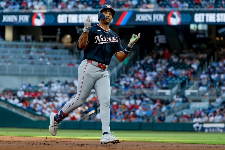 Washington Nationals' Daylen Lile reacts while rounding the bases after hitting a solo home run against the Atlanta Braves during the second inning of a baseball game, Thursday, July 30, 2026, in Atlanta. (AP Photo/Erik S. Lesser)