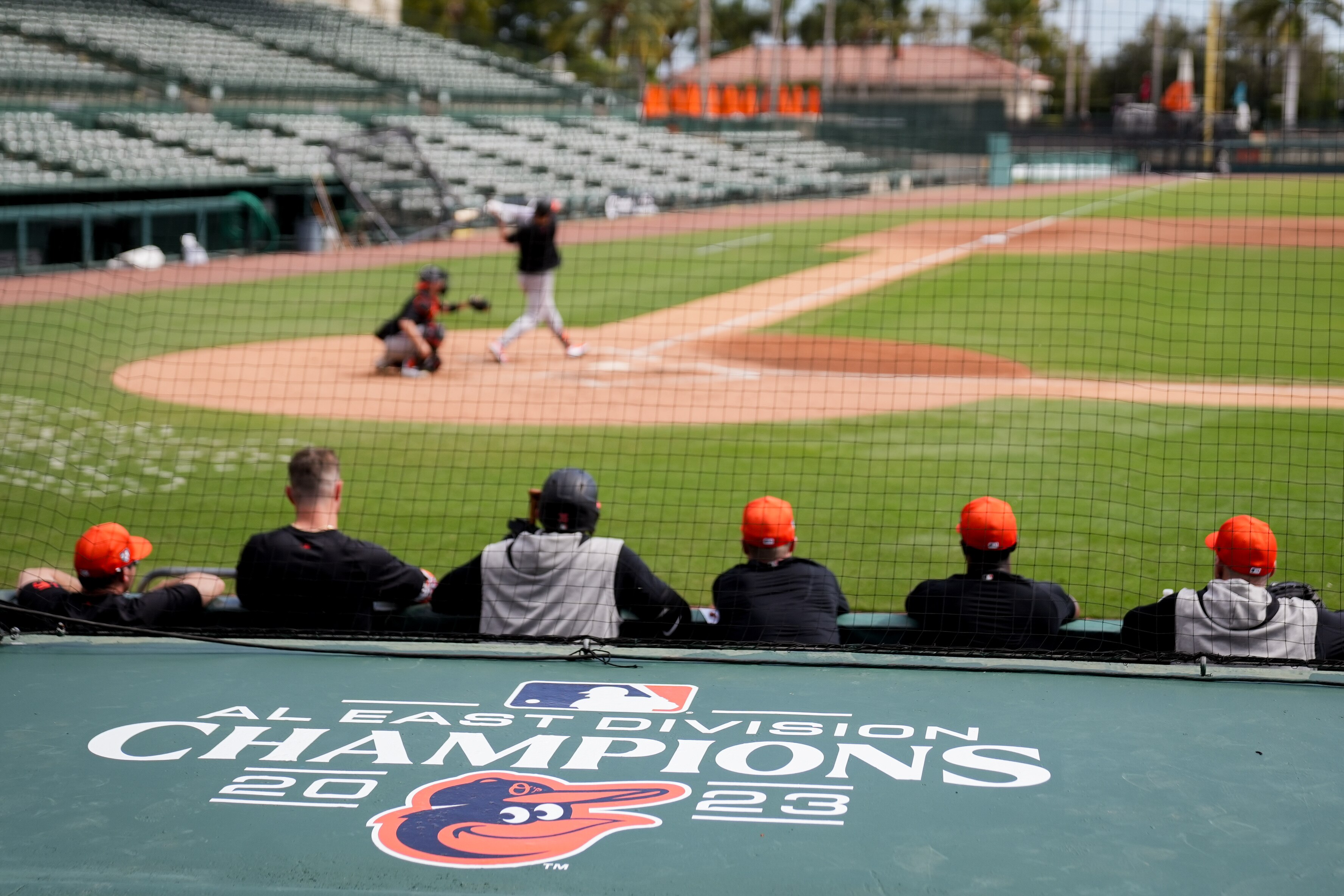 The freshly applied Baltimore Orioles AL East Champions decal is seen on the dugout during the team’s spring training session at Ed Smith Stadium on Feb. 23, 2024.