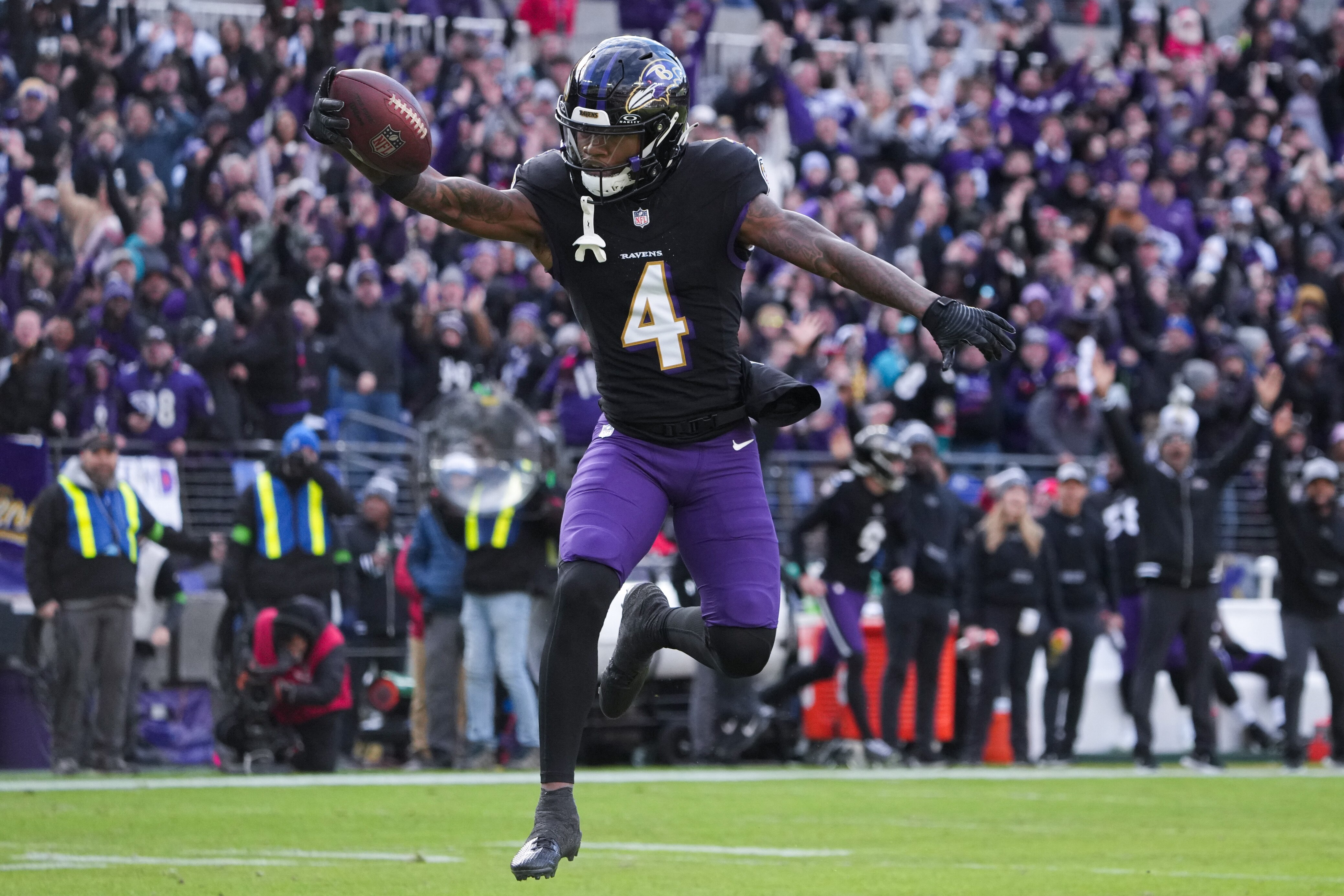 Baltimore Ravens wide receiver Zay Flowers (4) leaps into the end zone to score against the Miami Dolphins at M&T Bank Stadium on Sunday, Dec. 31, 2023. The Ravens won, 56-19, to secure the best record in the AFC.