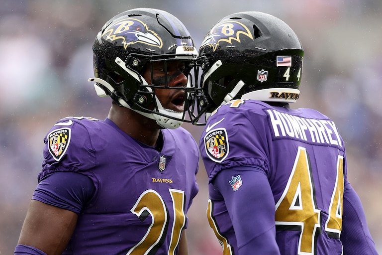 BALTIMORE, MARYLAND - OCTOBER 02: Brandon Stephens #21 and Marlon Humphrey #44 of the Baltimore Ravens celebrate after Humphrey made an interception in the first quarter against the Buffalo Bills at M&T Bank Stadium on October 02, 2022 in Baltimore, Maryland.