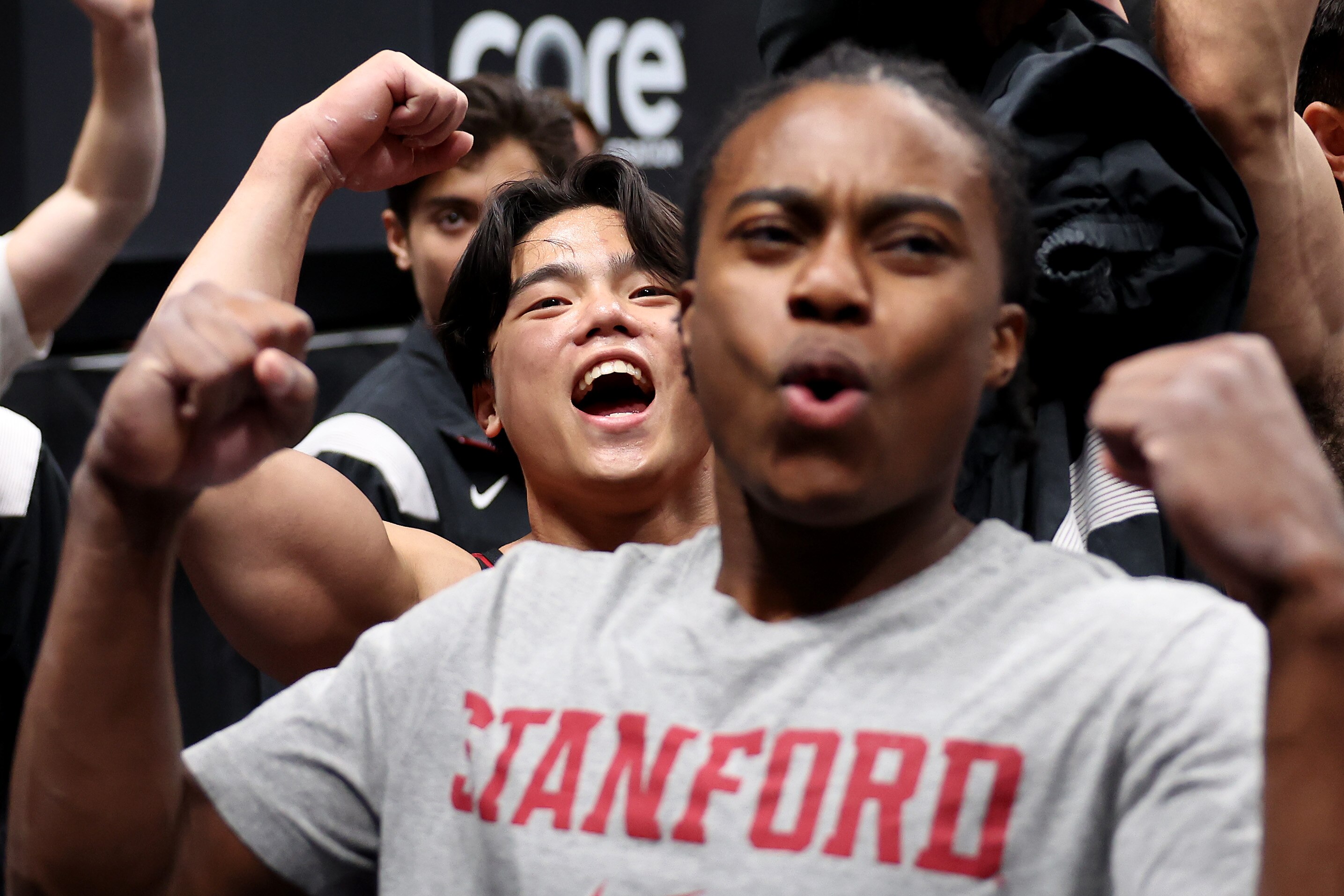 Second-place finisher Khoi Young of Bowie, right, and national champion Asher Hong cheer their finishes Saturday night in San Jose, California.