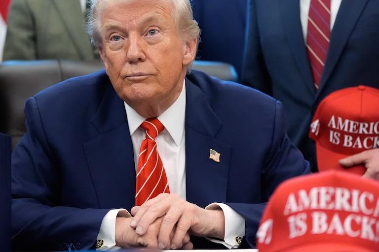 President Donald Trump speaks to reporters after signing a spending bill that ends a partial shutdown of the federal government in the Oval Office of the White House, Tuesday, Feb. 3, 2026, in Washington.