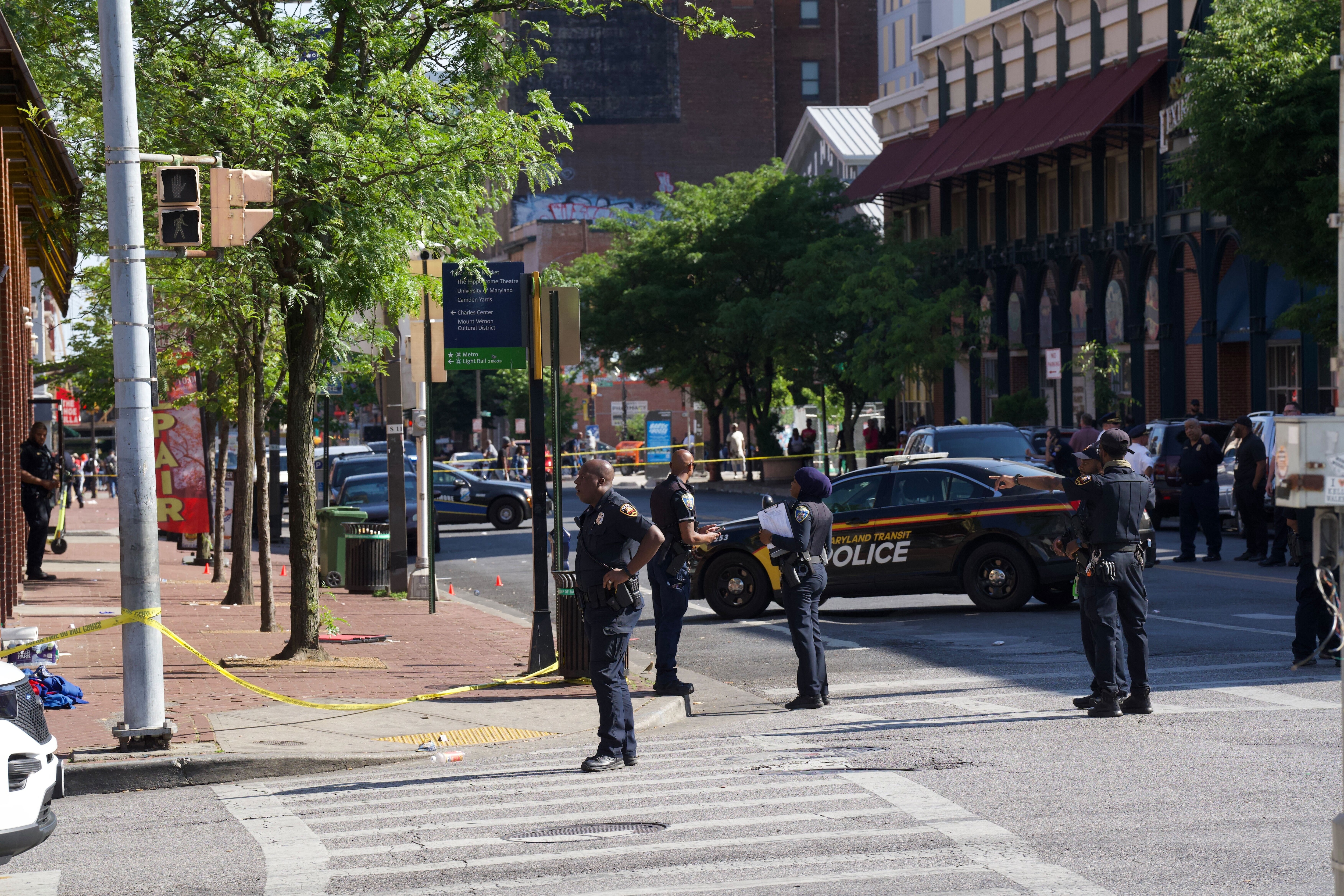 Police respond to a shooting near the intersection of North Eutaw and West Saratoga streets on Friday, May 26.