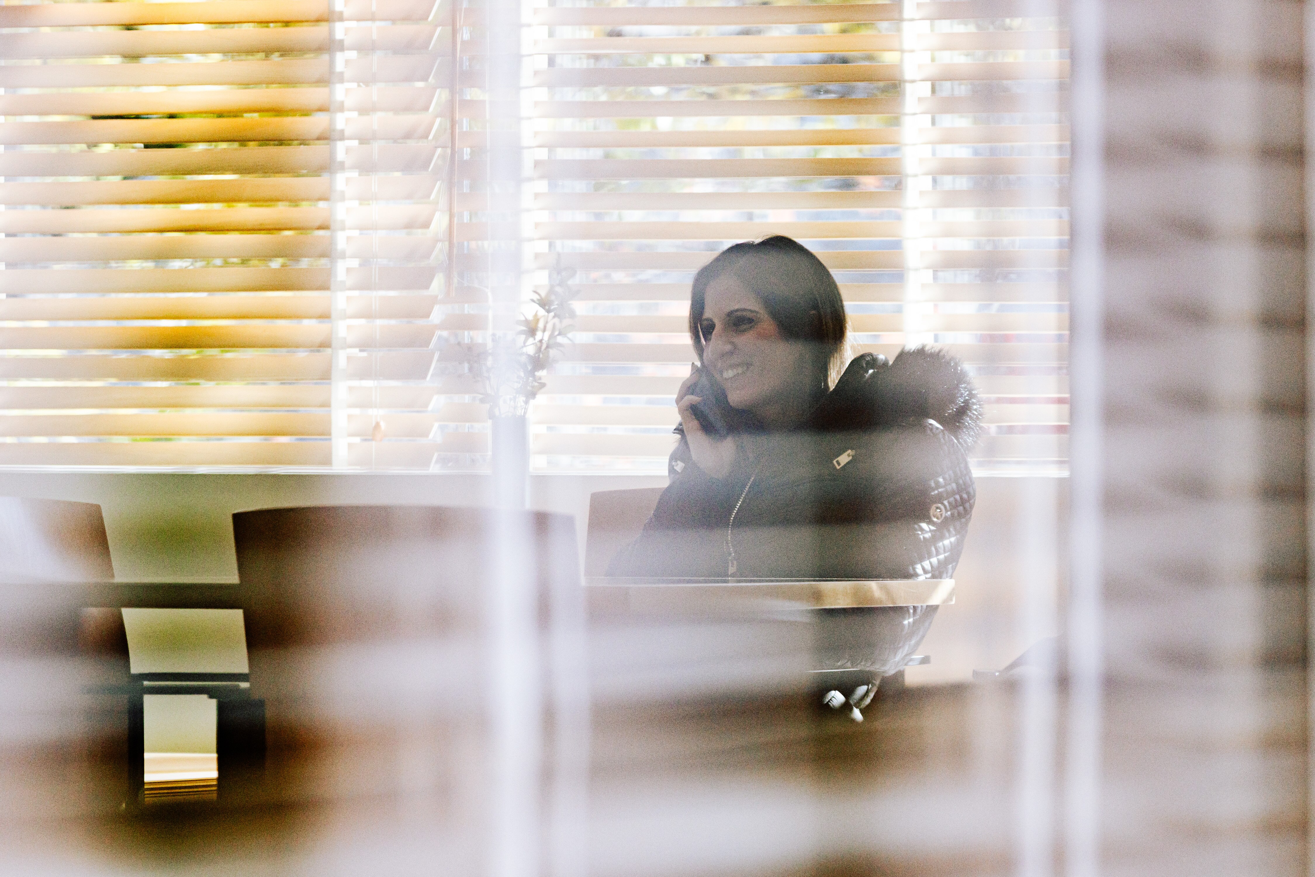 Maryland State Senator Dalya Attar speaks on the phone in the cafeteria of the Edward A. Garmatz Courthouse after pleading not guilty in federal court to extortion and conspiracy charges in 2025.