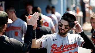 Blaze Alexander is greeted by teammates after scoring on a double by Jeremiah Jackson during the seventh inning of Sunday's game against the Los Angeles Dodgers.