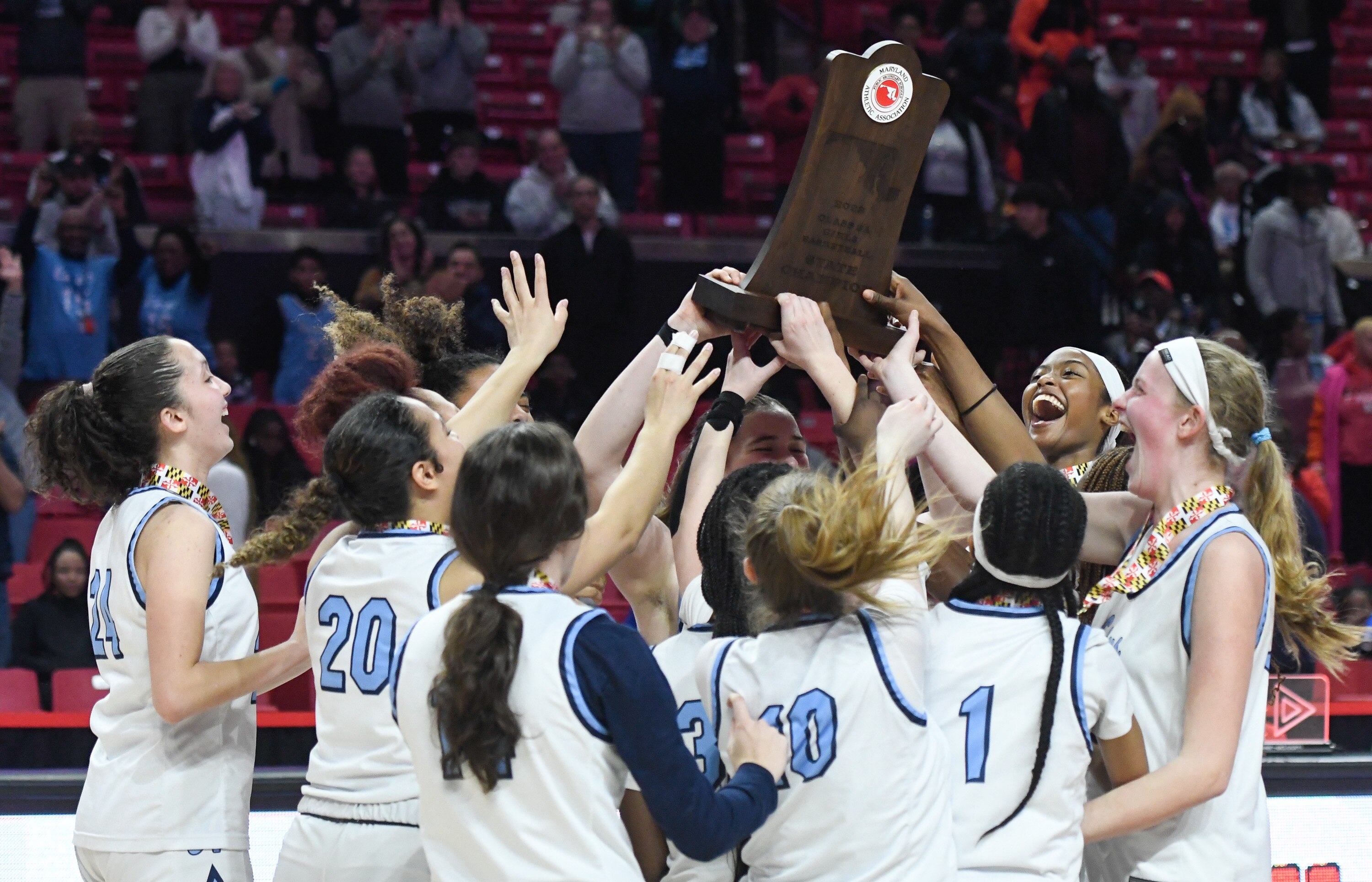 Howard celebrates after beating Poly 64-52 in the Class 3A state girls basketball final in College Park on Friday, March 10, 2023.