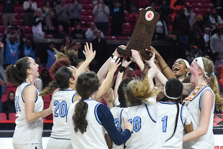 Howard celebrates after beating Poly 64-52 in the Class 3A state girls basketball final in College Park on Friday, March 10, 2023.