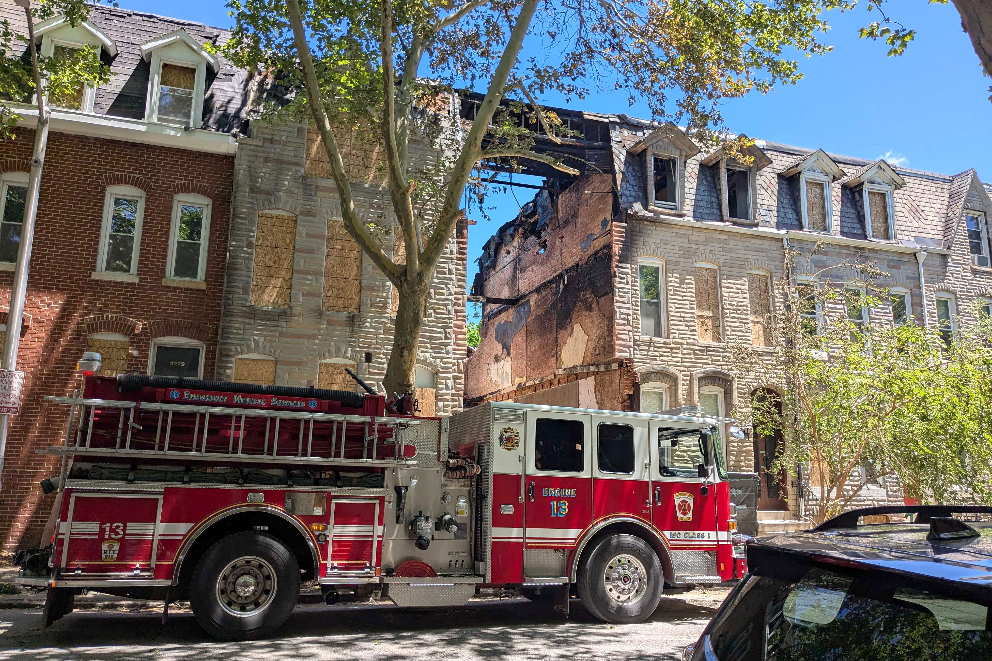 SATURDAY, MAY 30, 2026 - A Baltimore City fire truck at the site of the fatal house fire in the 2200 block of Guilford Avenue in Barclay. The three-alarm fire occurred on Thursday.