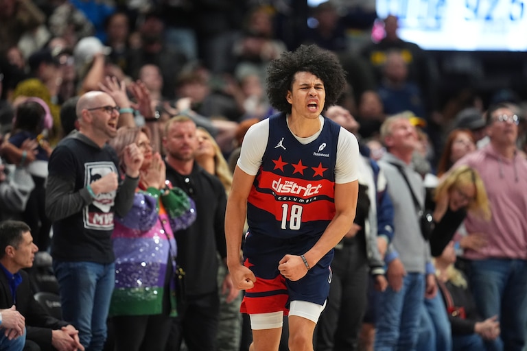 Washington Wizards forward Kyshawn George (18) reacts after hitting a 3-point basket in the second half of an NBA basketball game Saturday, March 15, 2025, in Denver.