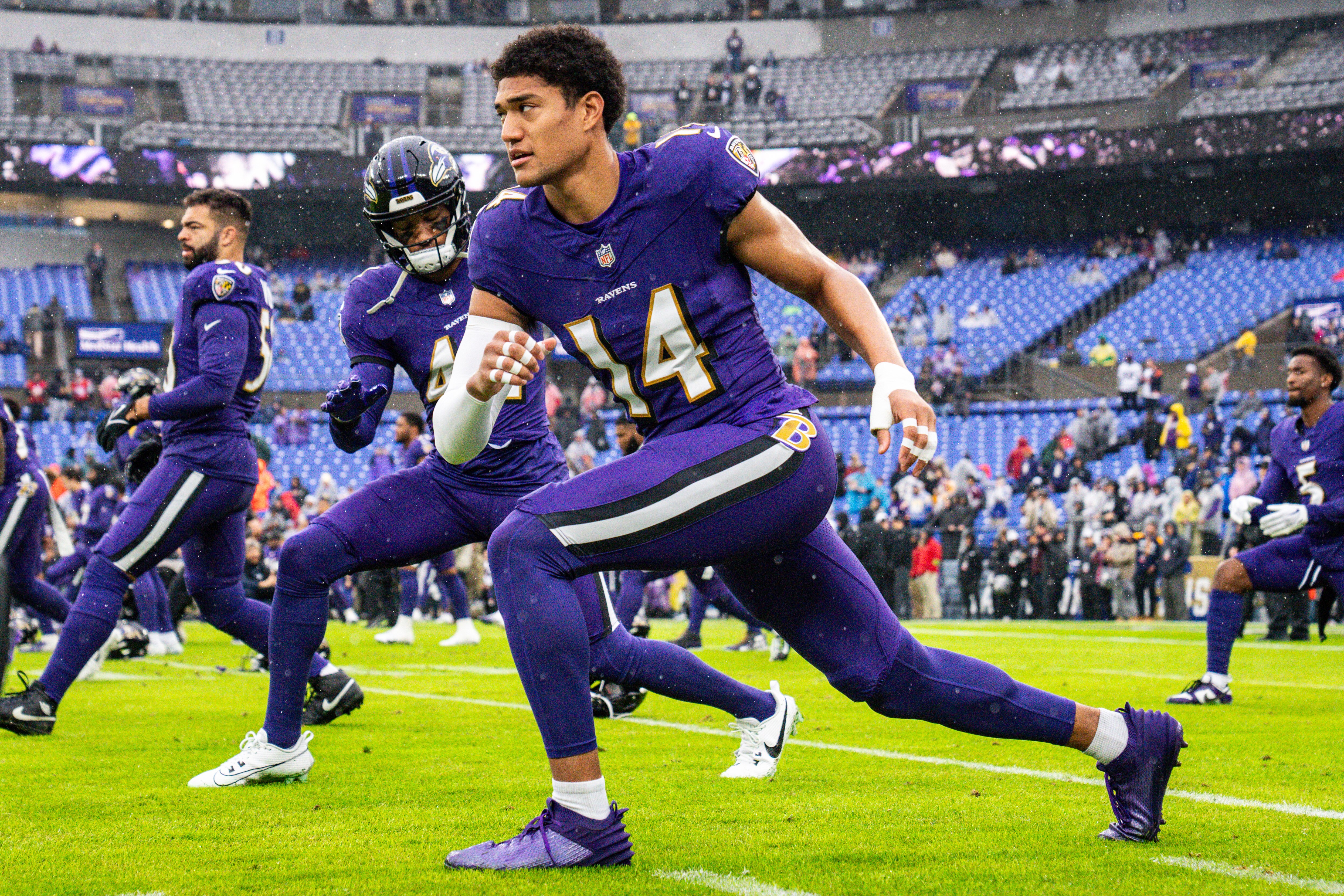 Baltimore Ravens safety Kyle Hamilton (14) warms up before the game against the Los Angeles Rams at M&T Bank Stadium on Sunday, Dec. 10, 2023.