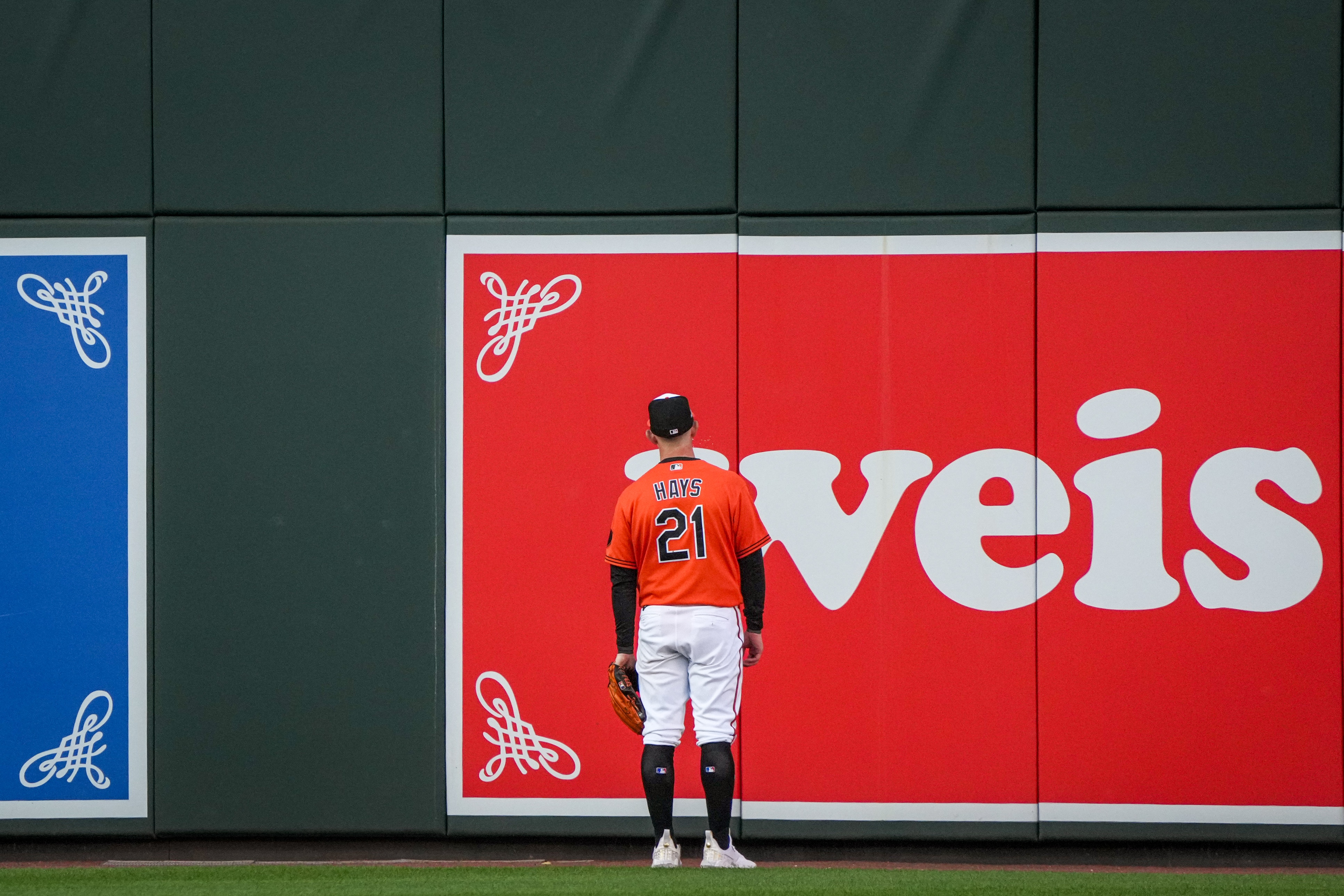 Orioles left fielder Austin Hays watches as Rangers catcher Mitch Garver’s grand slam flies over the wall during the third inning of Game 2 of the ALDS on Sunday at Camden Yards.