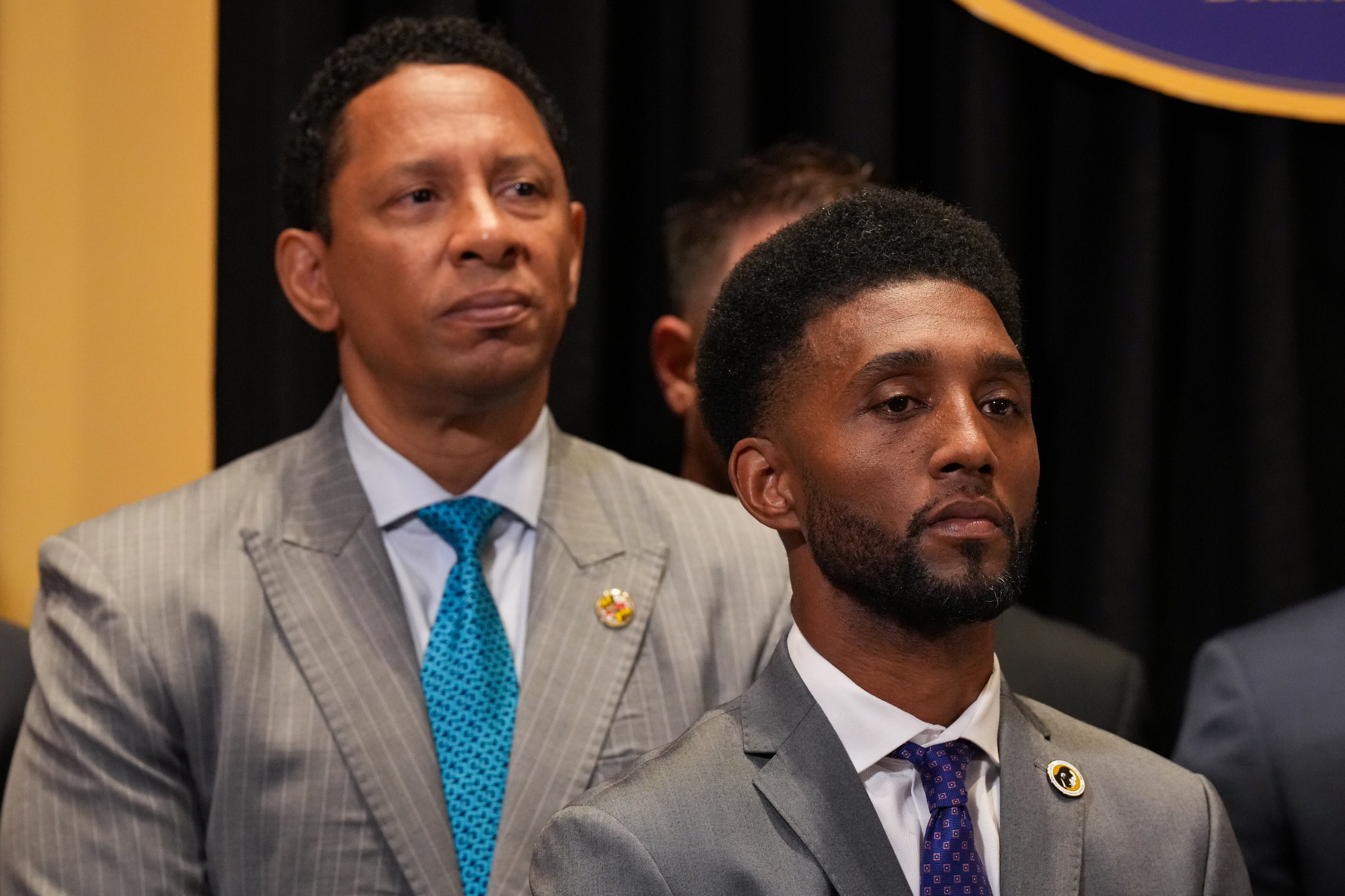 Baltimore Mayor Brandon Scott, flanked by State’s Attorney Ivan Bates, are pictured last summer in a rare joint appearance.