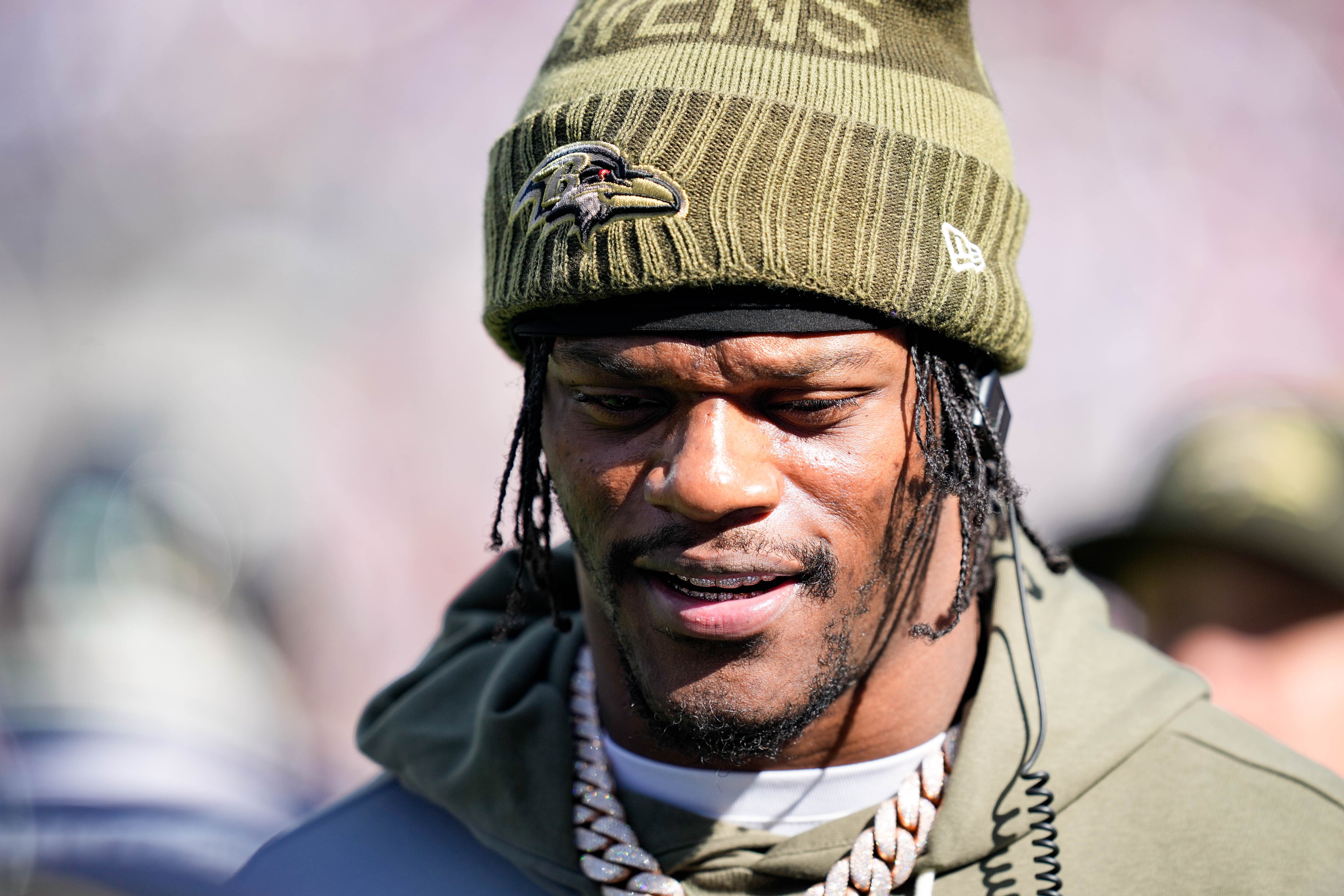 Ravens quarterback Lamar Jackson (8) speaks with teammates on the sidelines during the team’s Week 8 game against the Chicago Bears.