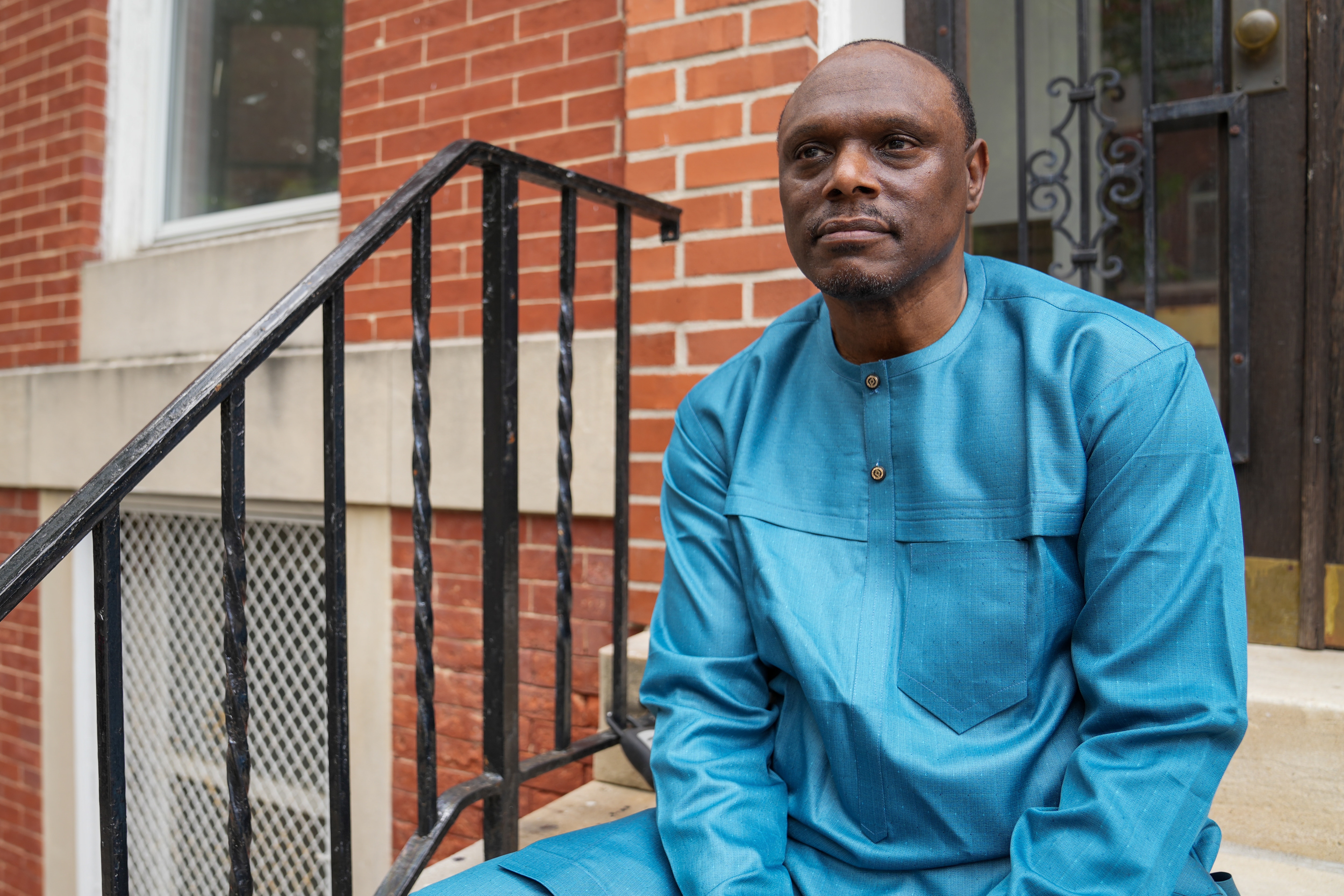 Cleo Manago, director of the Pride Center of Maryland, sits for a portrait outside of the Pride Center’s new location.