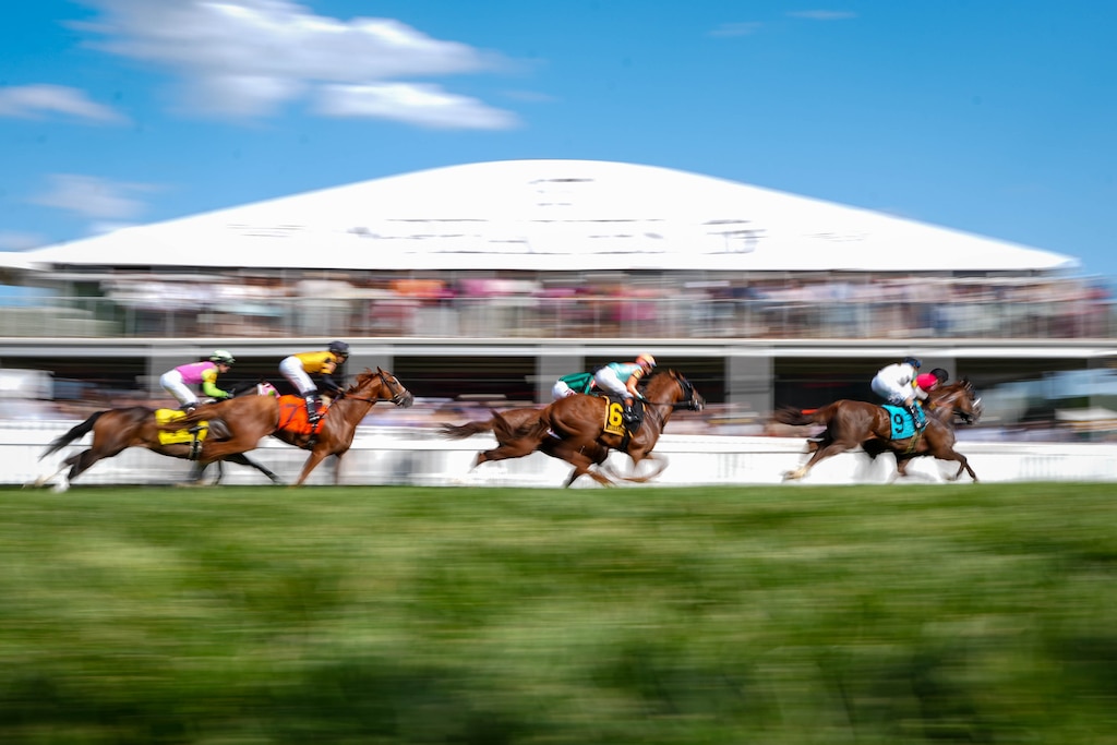 Jockeys ride their horses during the James W. Murphy Stakes on Preakness Day at Pimlico Race Course in Baltimore, Md. on Saturday, May 17, 2025.