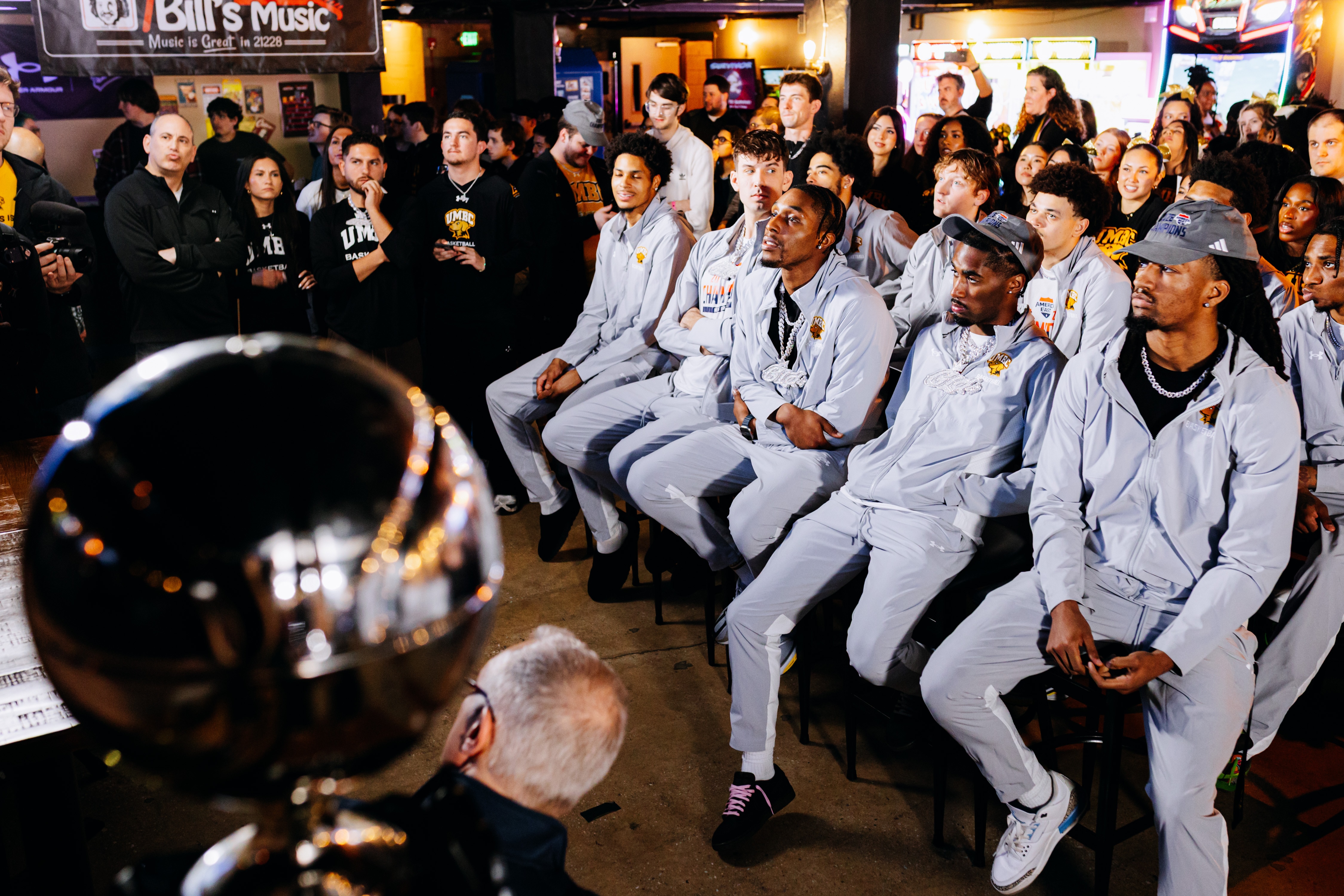 The UMBC men’s basketball team watches the March Madness bracket Selection Sunday show at El Guapo in Catonsville.