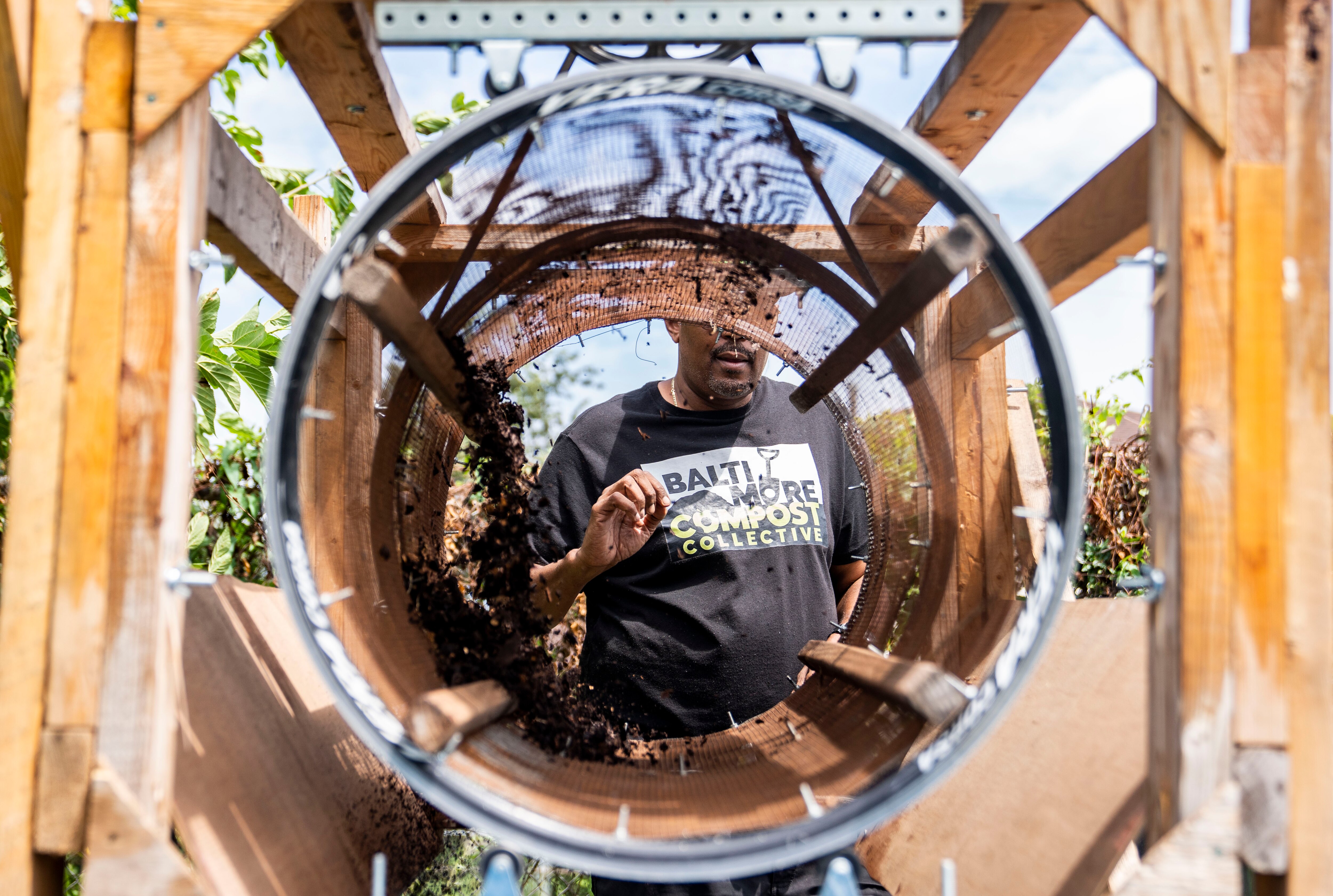 Marvin Hayes uses his trommel sifter to get the black gold soul enhancer at Filbert Street Garden, in Baltimore, Tuesday, August 8, 2023. 
