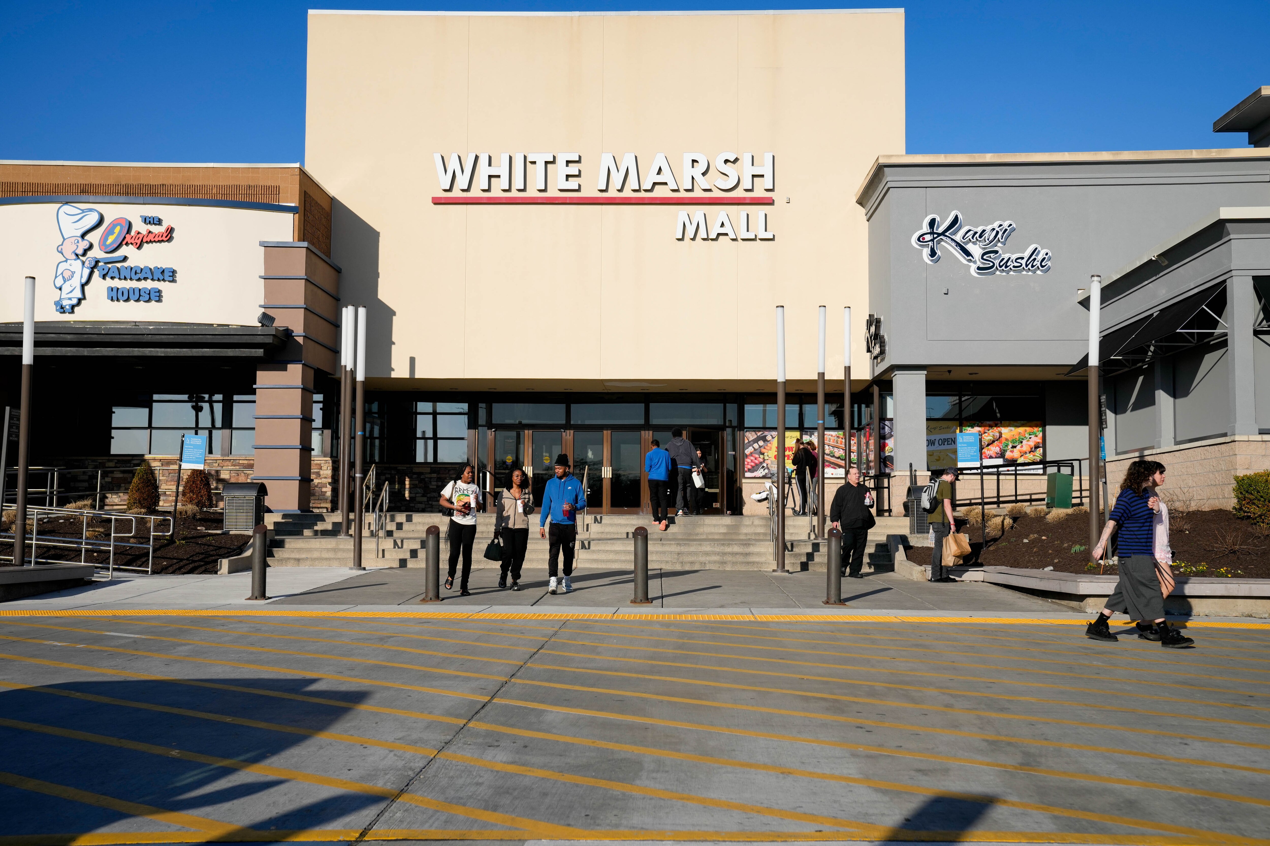Customers enter and exit White Marsh Mall, where Baltimore County Police arrested six teenagers after a “link-up” last week.