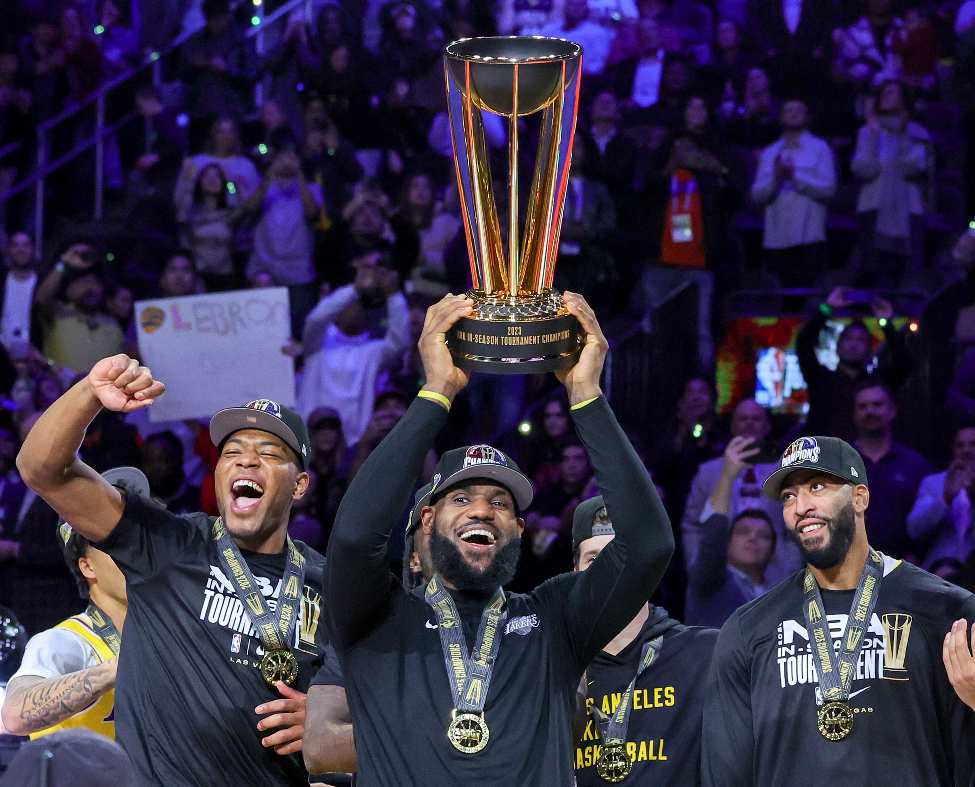 Rui Hachimura #28, LeBron James #23 and Anthony Davis #3 of the Los Angeles Lakers celebrate with the trophy after the team's 123-109 victory over the Indiana Pacers to win the championship game of the inaugural NBA In-Season Tournament at T-Mobile Arena on Dec. 9, 2023 in Las Vegas, Nevada.