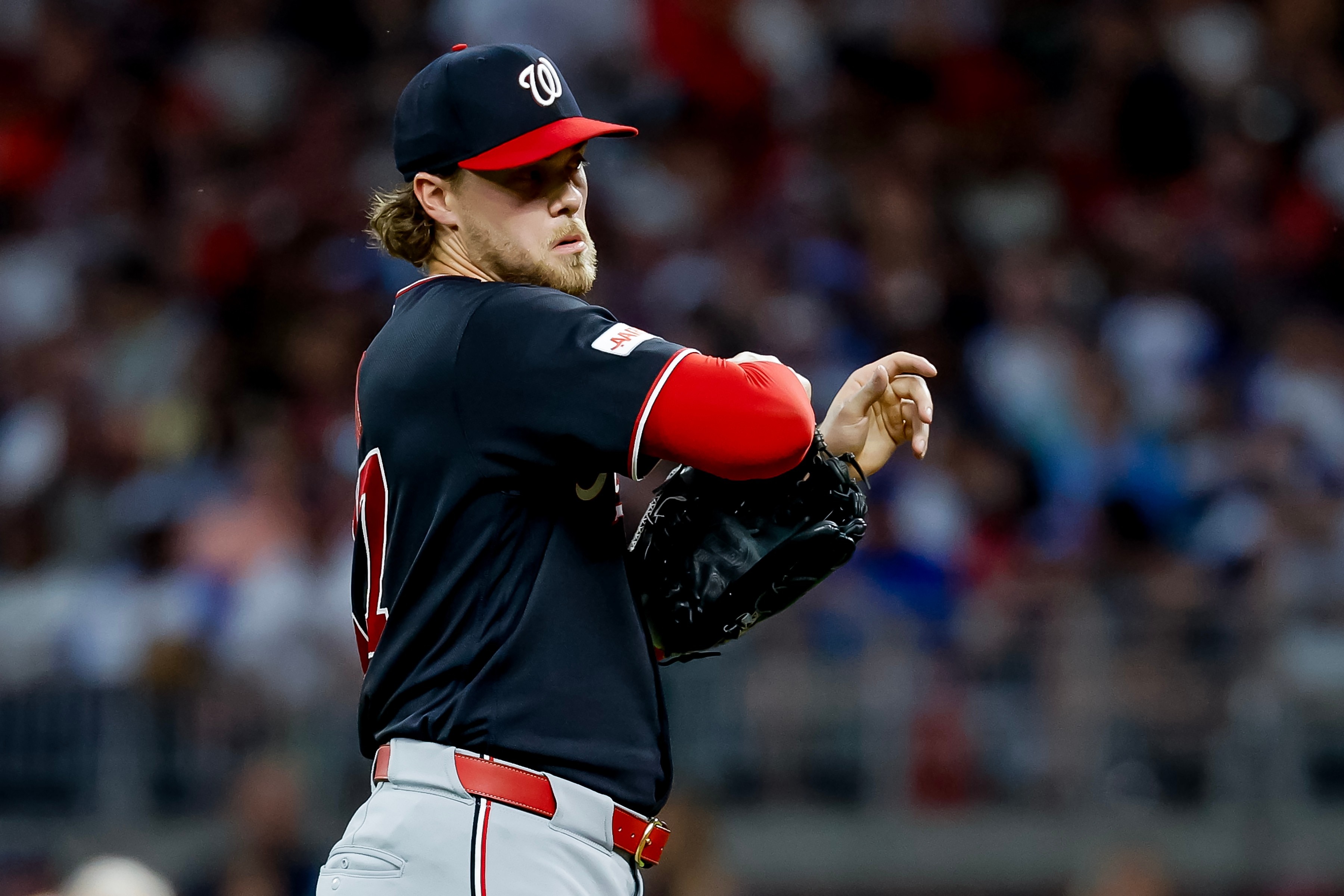 Washington Nationals pitcher Jake Irvin reacts in between pitches to an Atlanta Braves batter during the sixth inning of a baseball game, Thursday, July 30, 2026, in Atlanta. (AP Photo/Erik S. Lesser)