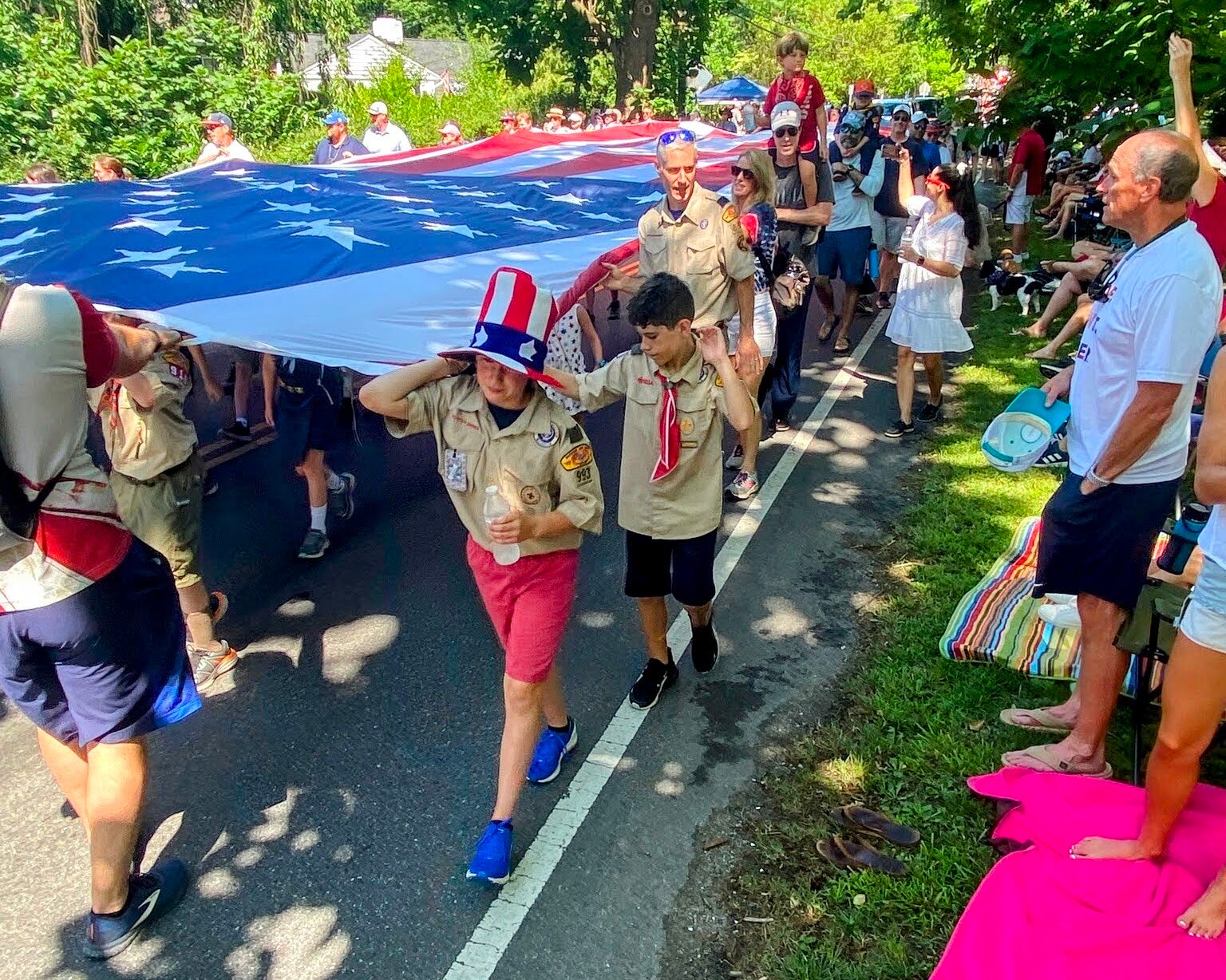 As many as 50 volunteers carry the 30-by-60 Nathaniel McDavitt Flag during the Severna Park Independence Day Parade. The giant Stars and Stripes is displayed every year in memory of a 2011 Severna Park High School graduate who died in Jordan while serving in 2016.