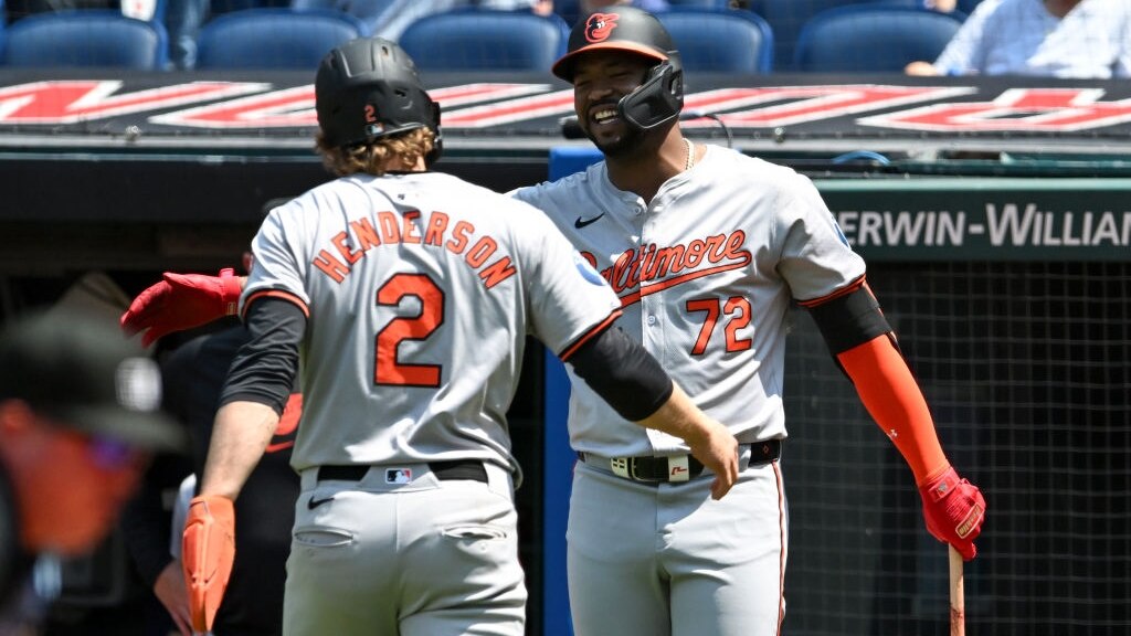 CLEVELAND, OHIO - AUGUST 04: Gunnar Henderson #2 and Eloy Jiménez #72 of the Baltimore Orioles celebrate Henderson scoring on a double hit by teammate Ryan O'Hearn (not pictured) during the first inning against the Cleveland Guardians at Progressive Field on August 04, 2024 in Cleveland, Ohio. (Photo by Nick Cammett/Getty Images)