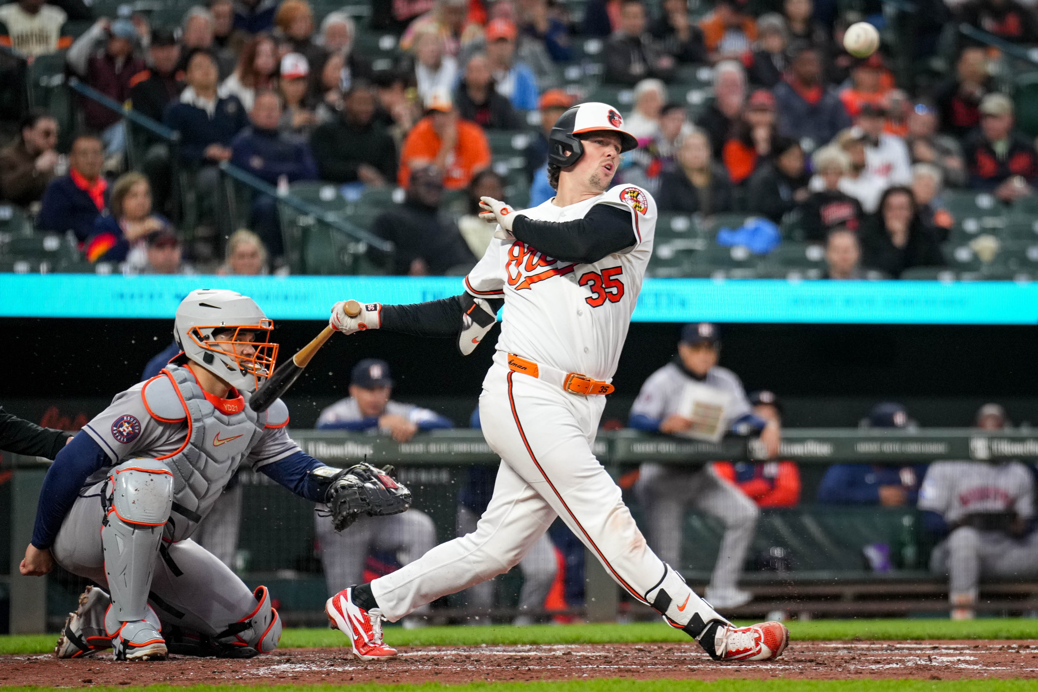 Orioles catcher Adley Rutschman swings at a pitch in the third inning of a game against the Houston Astros on April 28.