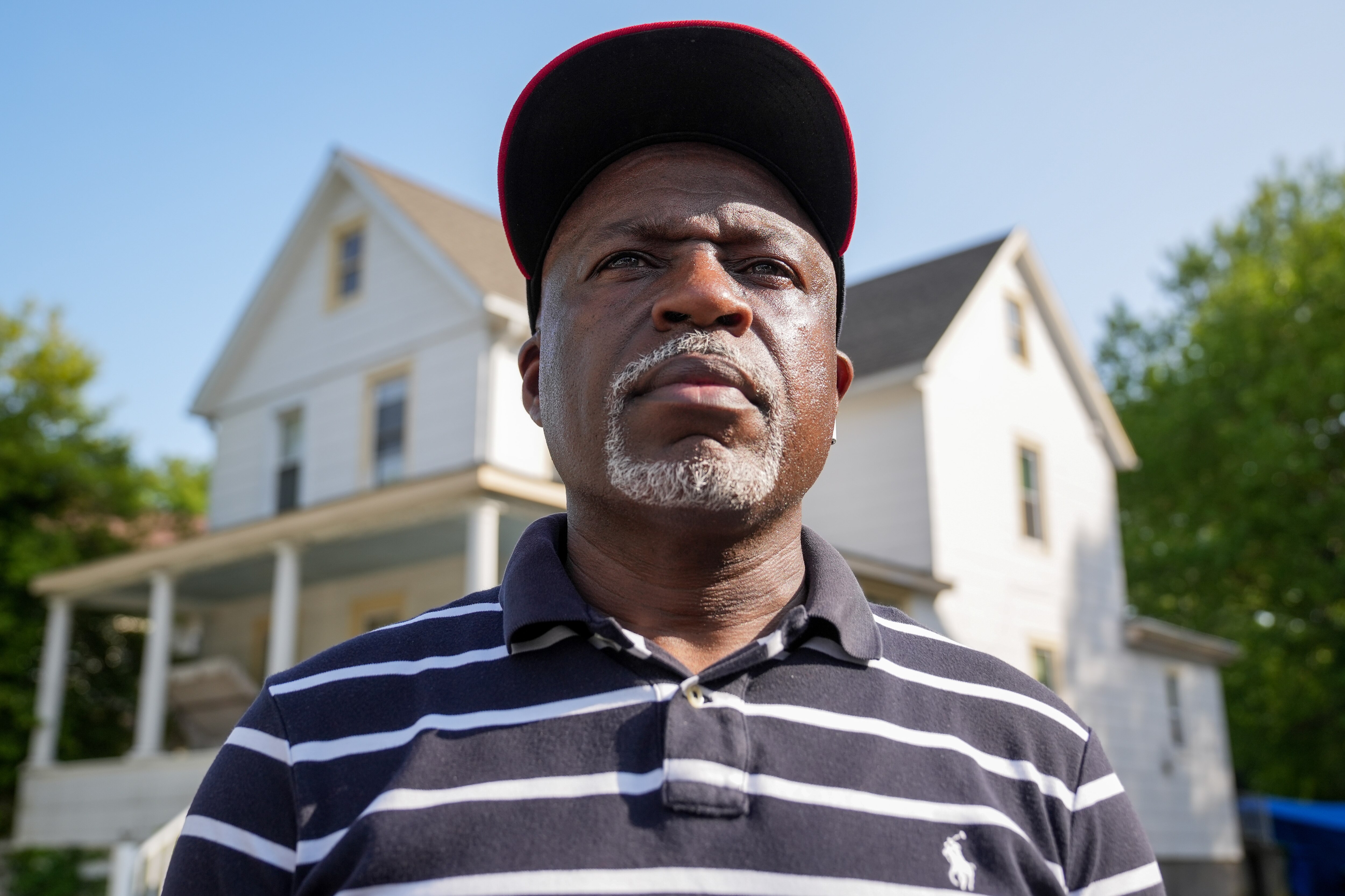 Jeffery Brooks Sr. stands for a portrait outside of the house where his son, Jeffery Brooks Jr., died in March, 2023. Prosecutors allege that Brooks Jr.’s roommate shot and killed Brooks Jr., and attempted to cover up the death.