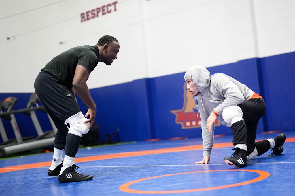 Eugene Harney, right, spars with Quincy Monday during wrestling practice at Hill Field House on Morgan State University’s campus in Baltimore, Md., on Monday, March 16, 2026.