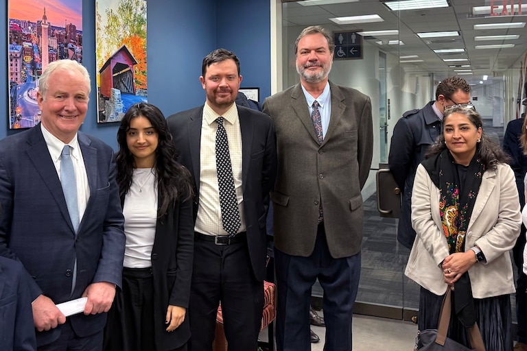 Rockville attorney Kowsar Gowhari (right) joined representatives for local anti-war groups for a meeting with Maryland Senator Chris Van Hollen (left).
