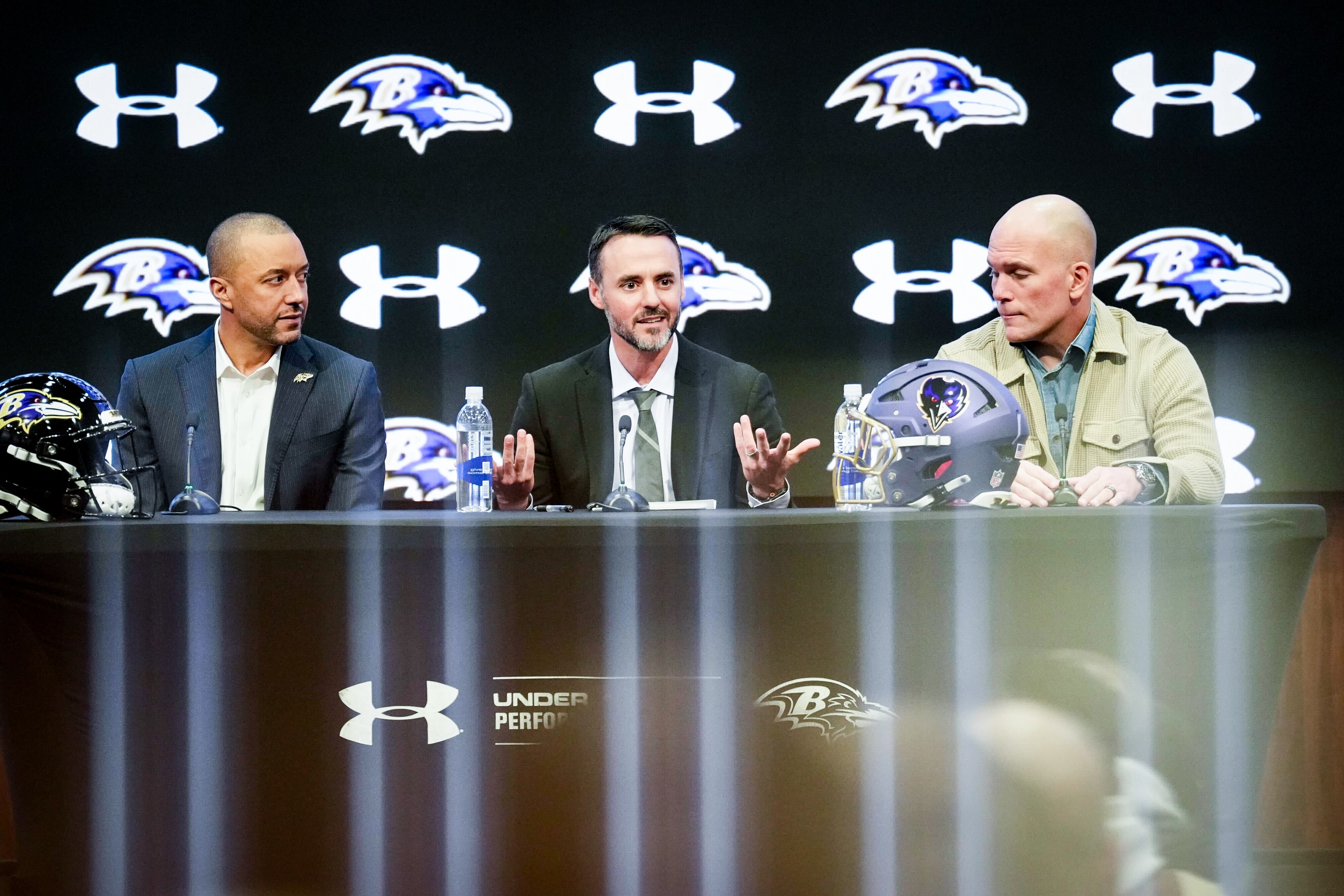 From left, Ravens President Sashi Brown, newly hired head coach Jesse Minter and GM/Executive Vice President Eric DeCosta hold a news conference announcing Minter’s hiring on Thursday at the Under Armour Performance Center.