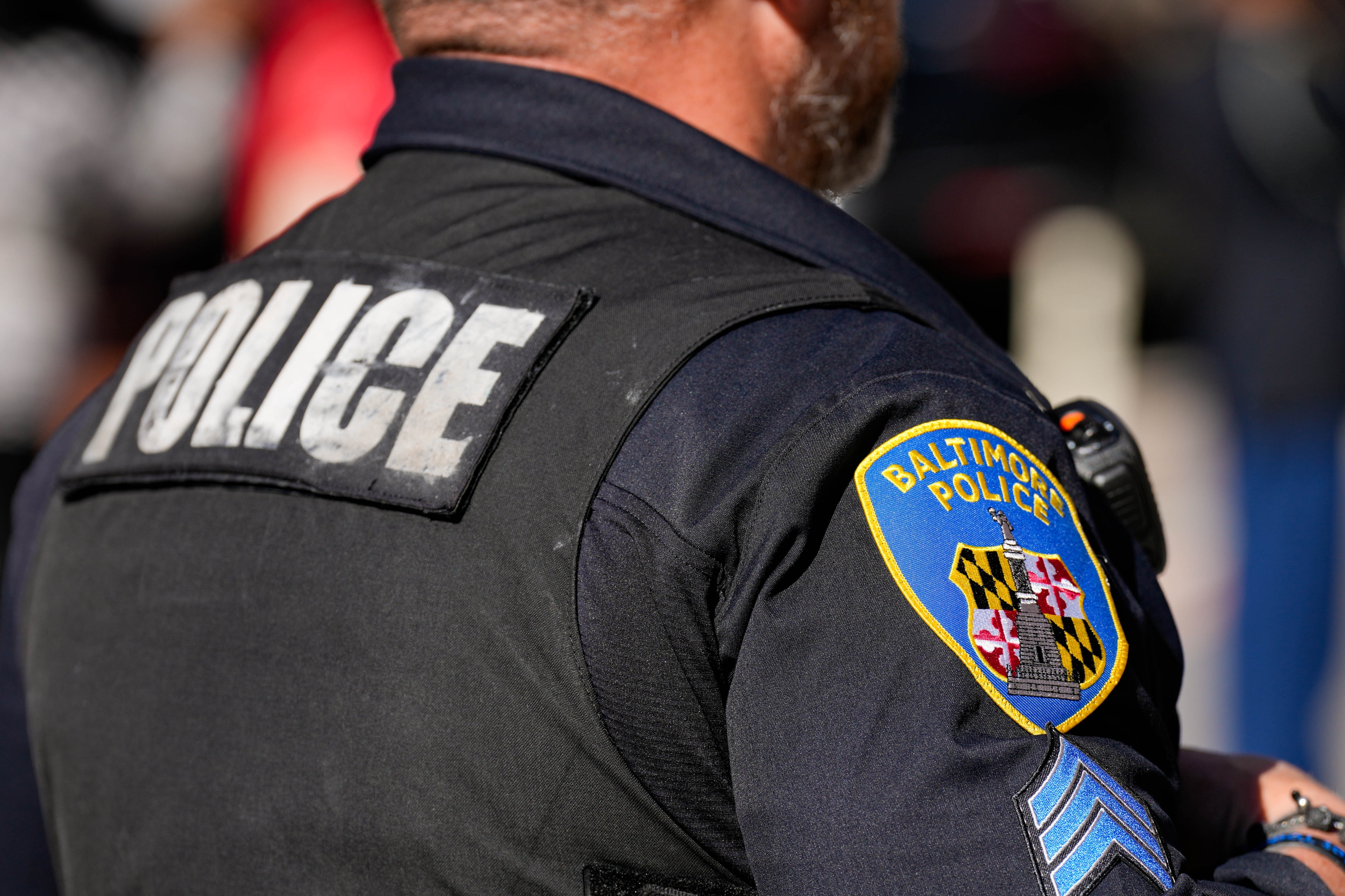 A Baltimore Police Department officer observes the 2025 Veterans Day parade in Baltimore, Md., on Saturday, November 8, 2025.