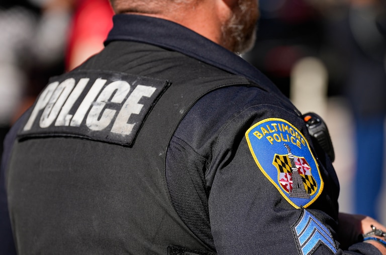 A Baltimore Police Department officer observes the 2025 Veterans Day parade in Baltimore, Md., on Saturday, November 8, 2025.