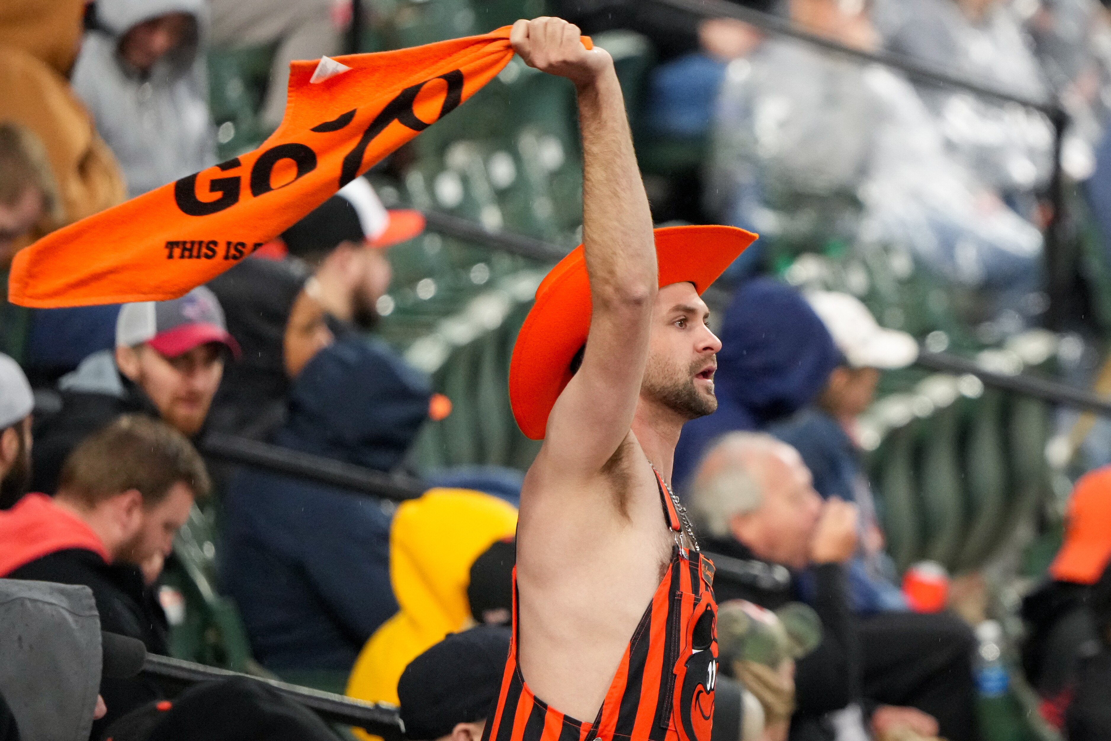 A Baltimore Orioles fan waves a rally towel over his head during a game against the Los Angeles Angels at Camden Yards on March 30.