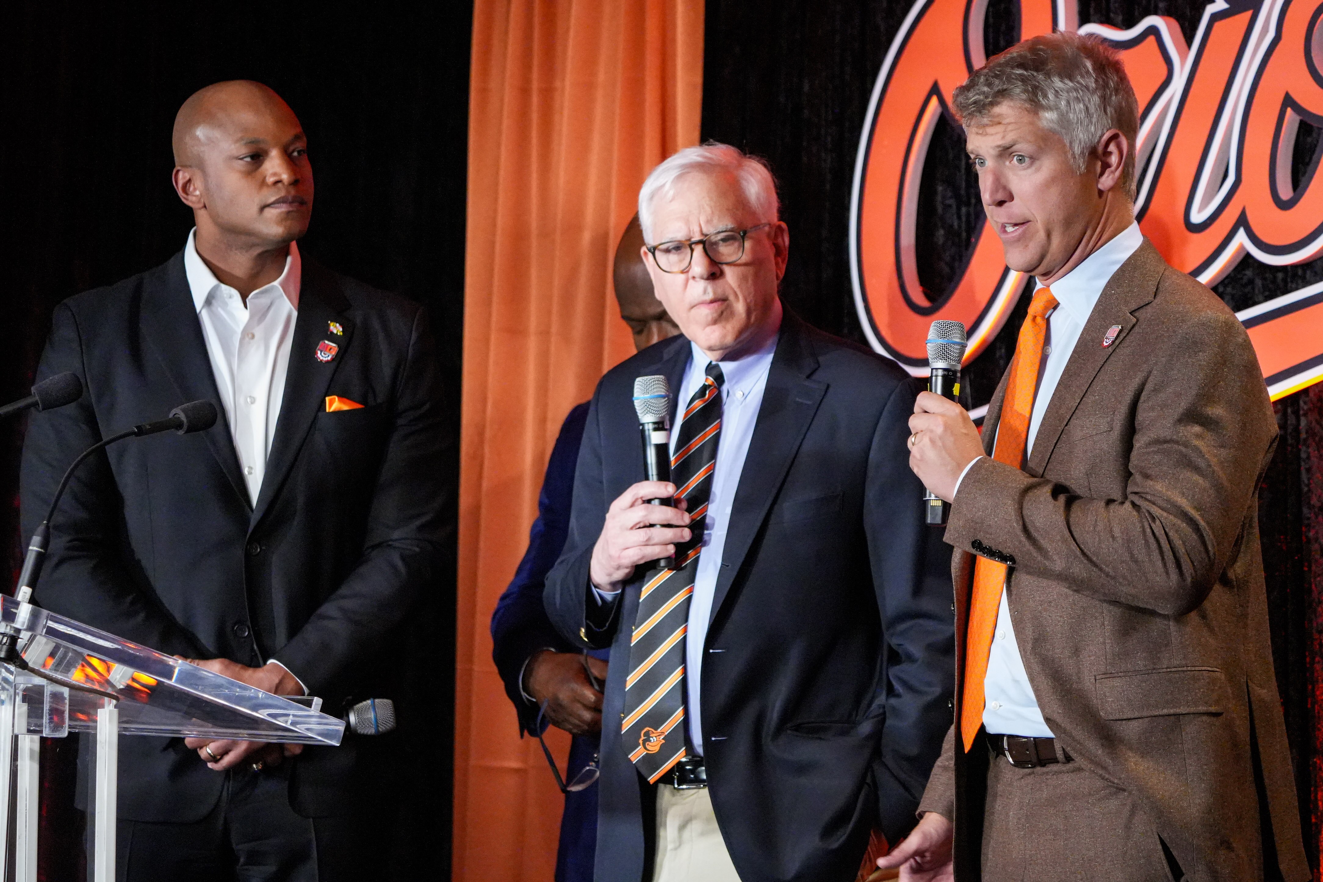 Orioles owner David Rubenstein, center, and general manager Mike Elias have raised the team’s payroll during the offseason.