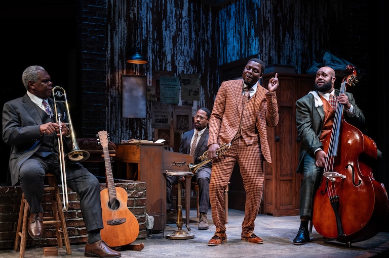 Band members Cutler, played by Craig Wallace, Toledo, played by Ro Boddie, Levee played by Yao Dogbe, and Slow Drag, played by Derrick Truby, spend much of the show rehearsing in recording studio’s cold, dingy basement.