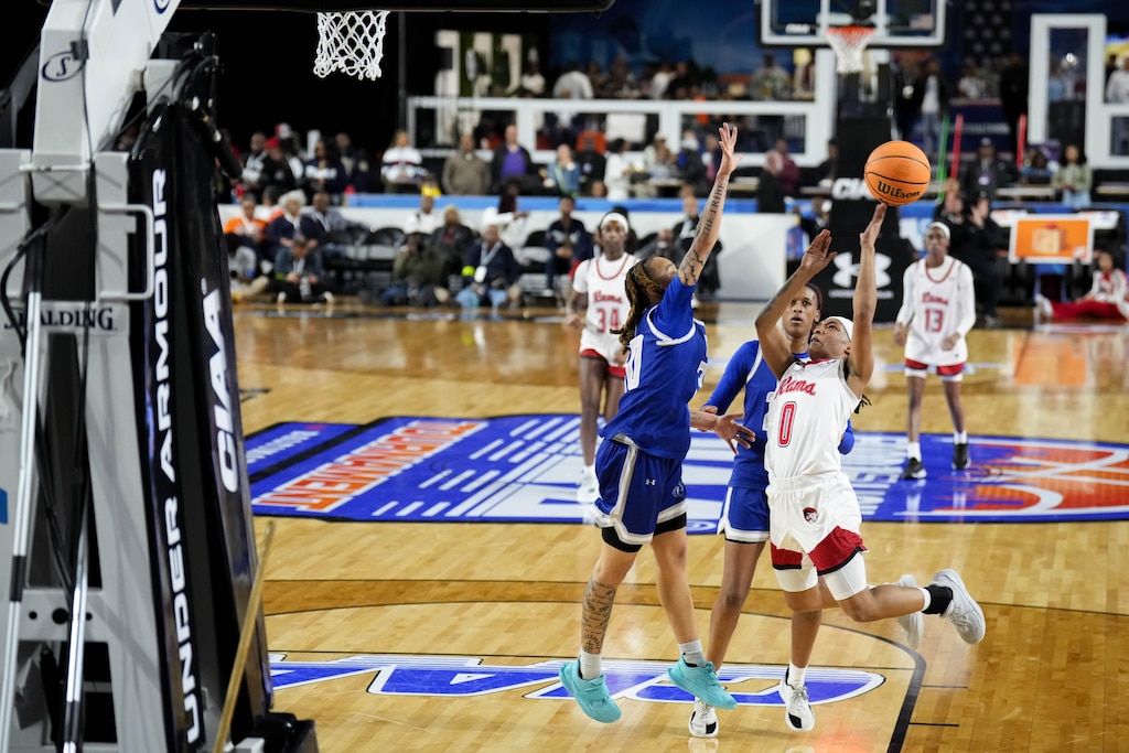 Winston Salem’s Nevaeh Farmer (0) makes a basket over Fayetteville State’s Talia Trotter (30) in the second quarter of the CIAA Women’s championship game in Baltimore, Md., on Saturday, February 28, 2026.