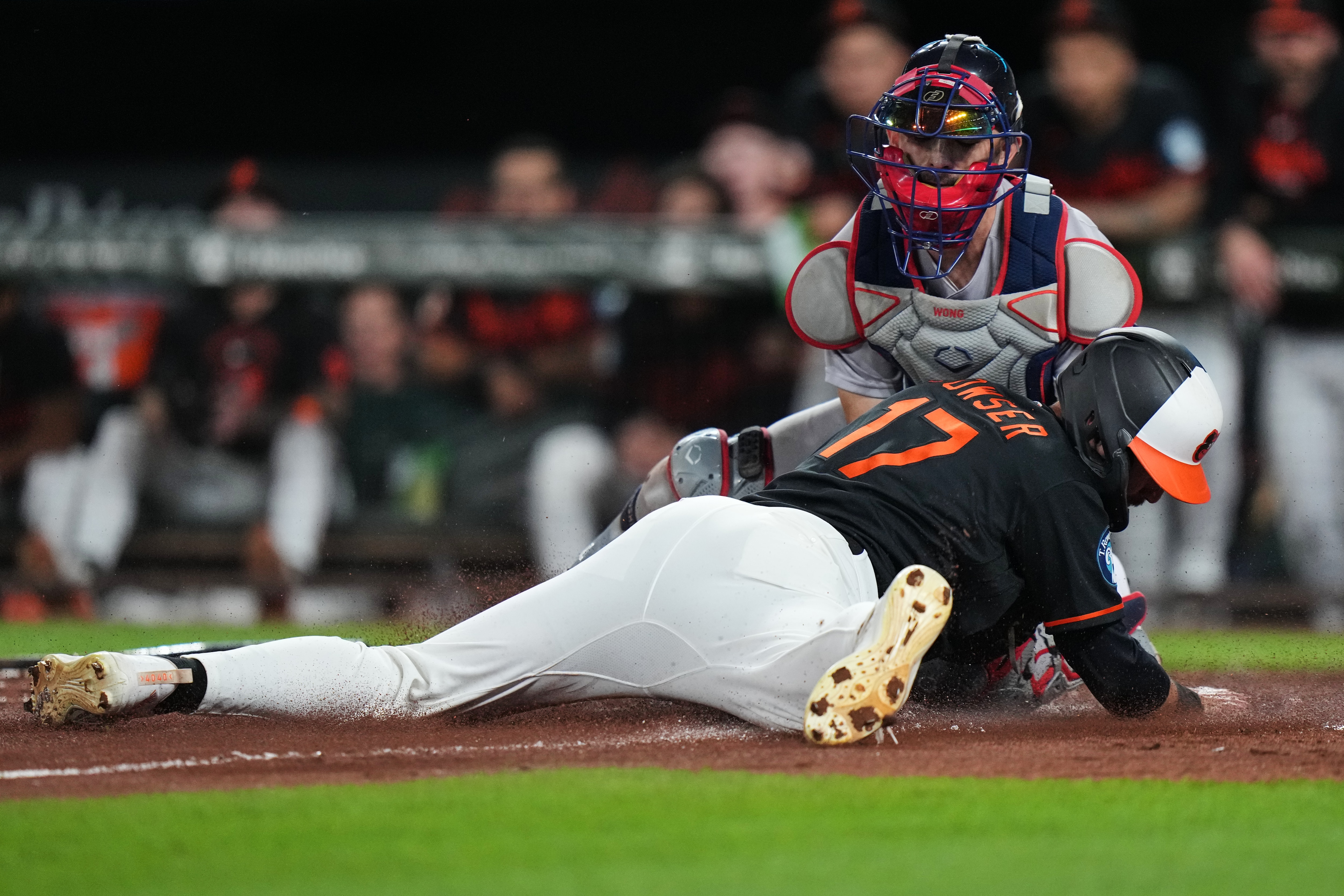 Baltimore Orioles' Colton Cowser (17) is tagged out at home by Boston Red Sox catcher Connor Wong, right, during the third inning of a baseball game, Saturday, Sept. 5, 2026, in Baltimore. (AP Photo/Stephanie Scarbrough)
