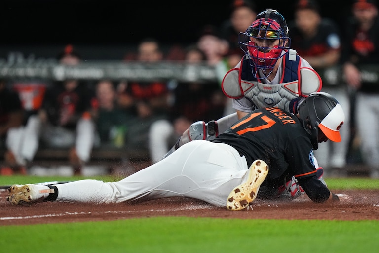 Baltimore Orioles' Colton Cowser (17) is tagged out at home by Boston Red Sox catcher Connor Wong, right, during the third inning of a baseball game, Saturday, Sept. 5, 2026, in Baltimore. (AP Photo/Stephanie Scarbrough)