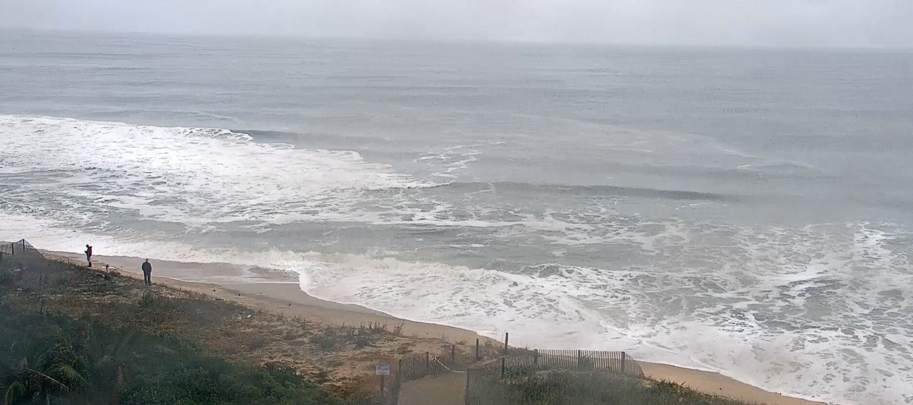 A nor'easter continues hitting Ocean City on Sunday bringing rain, 30 mph winds and flooding.