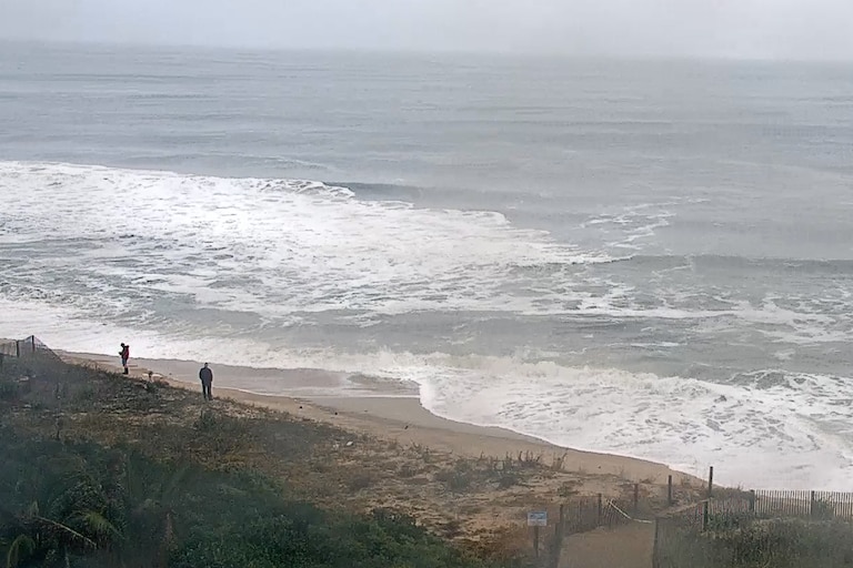 A nor'easter continues hitting Ocean City on Sunday bringing rain, 30 mph winds and flooding.