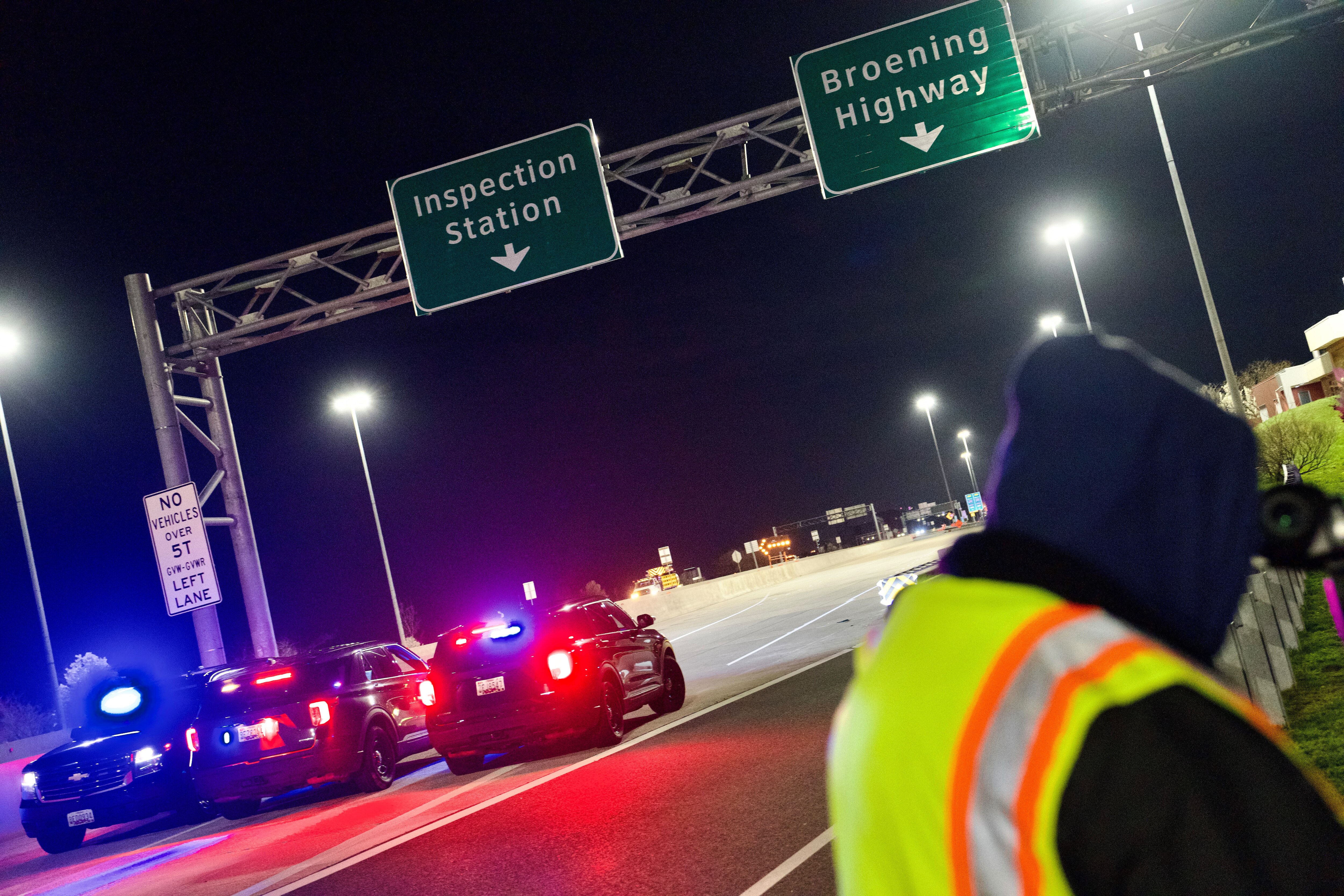 Officials close down access to the Key Bridge after it collapsed. A ship struck it in the early hours on Tuesday, March 26.