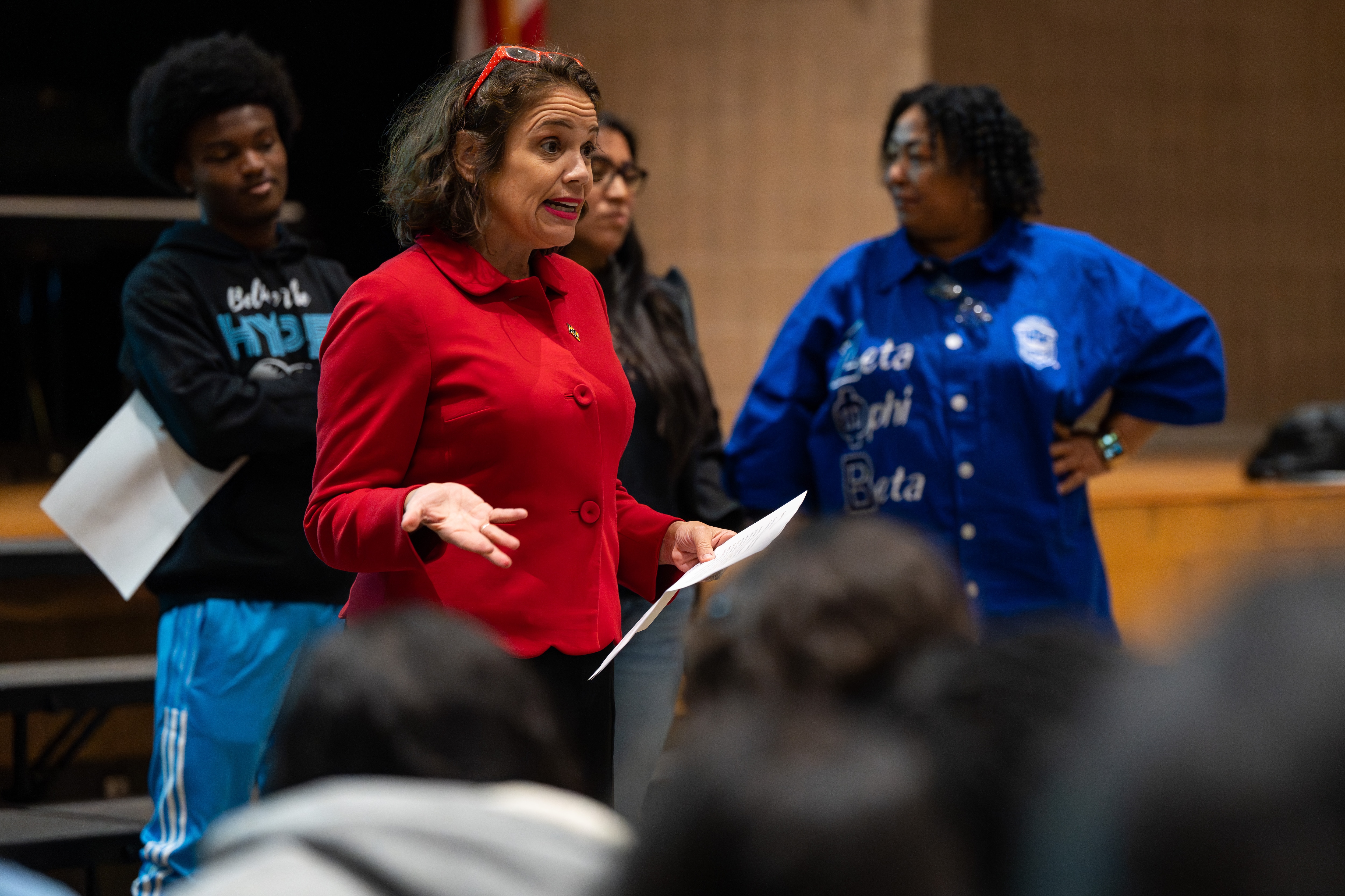 Odette Ramos speaks to Digital Harbor High School’s multilingual learners class in the auditorium.